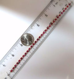Bracelet tennis en alternance de rubis naturels rouge vif et diamants, 6,88 carats, 14 carats*