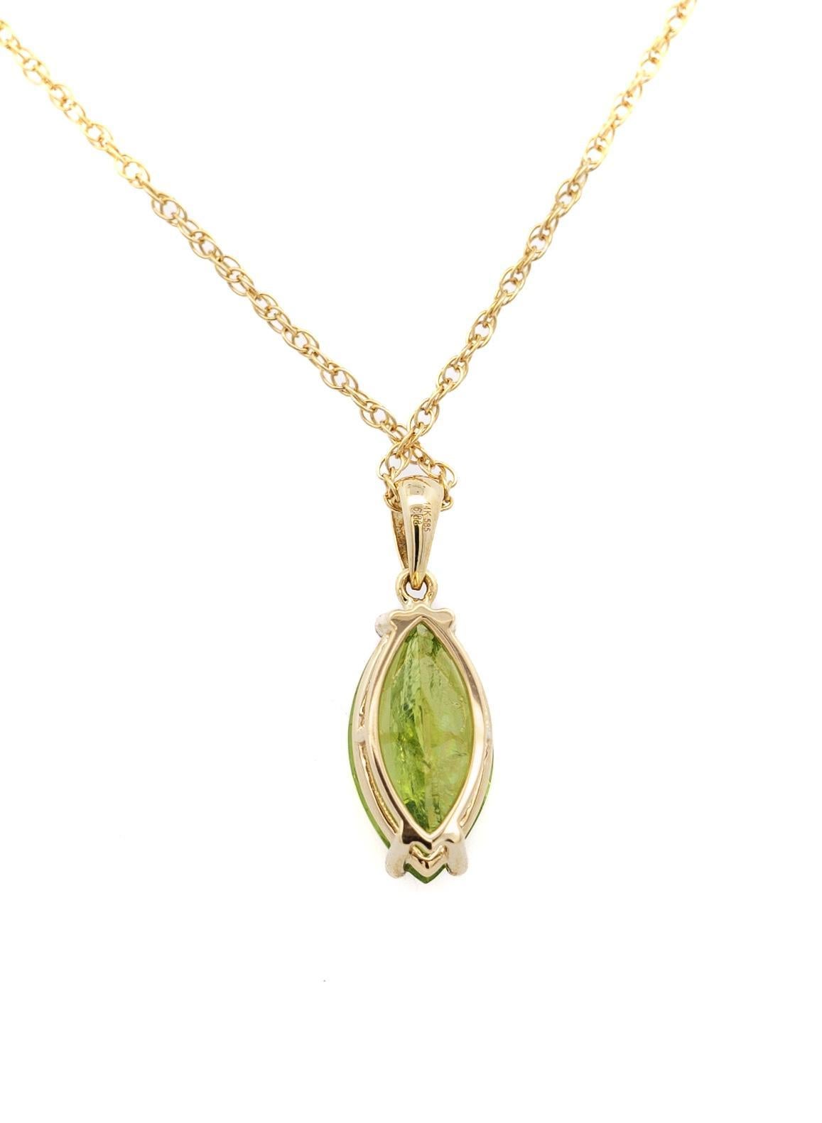6.88 Carat Peridot Solitaire Pendant Necklace in 14K Yellow Gold Rope Chain. Statement pendant necklace with an astonishing marquise cut, 2-prong set peridot stone dangling from the chain in a vibrant yellowish-green color. The contrast of the