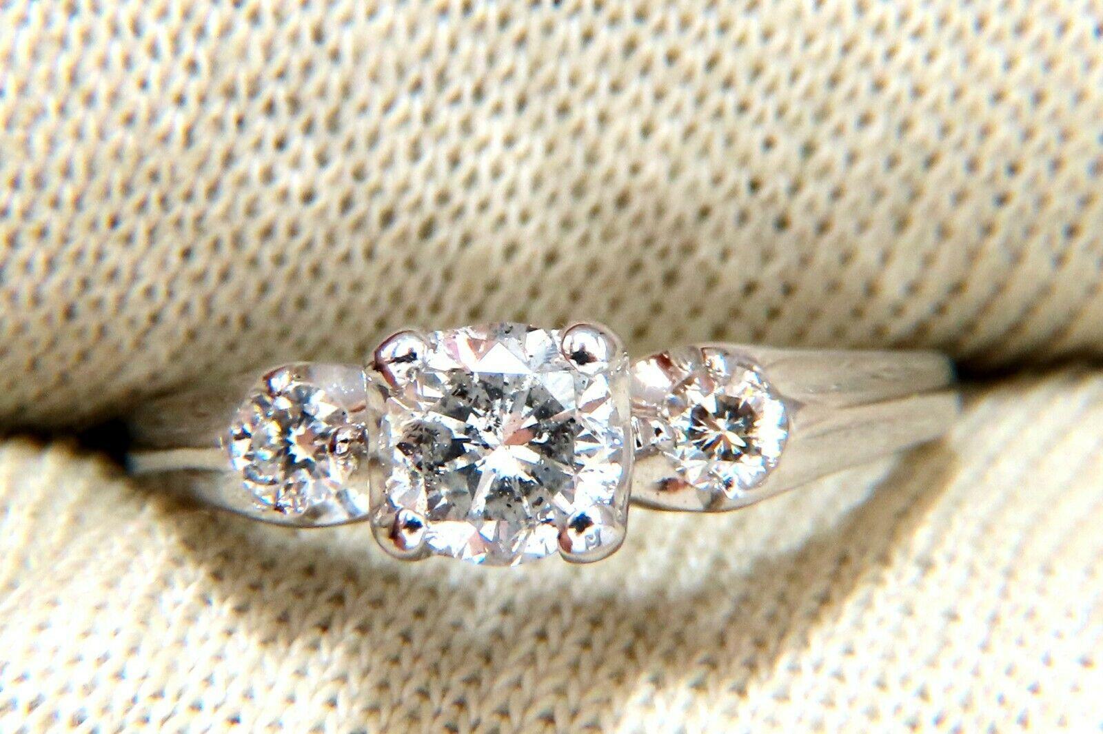 Vintage Solitaire & Band

.68ct Natural Round Diamond Center &

.60ct Natural Round Cut Accent Diamonds. 

Center: I-color I-3 Clarity.

Accents: Vs-2 clarity G color.

14kt white gold

3.8 Grams

Overall ring: 5.4mm wide

Depth: 5.6mm

Band: 3.5mm