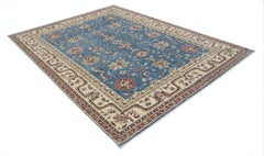 6.8x9.3 ft Hand Knotted Floral Turkish Area Rug with Blue Field and Beige Border