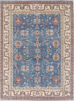 6.8x9.3 ft Hand Knotted Floral Turkish Area Rug with Blue Field and Beige Border