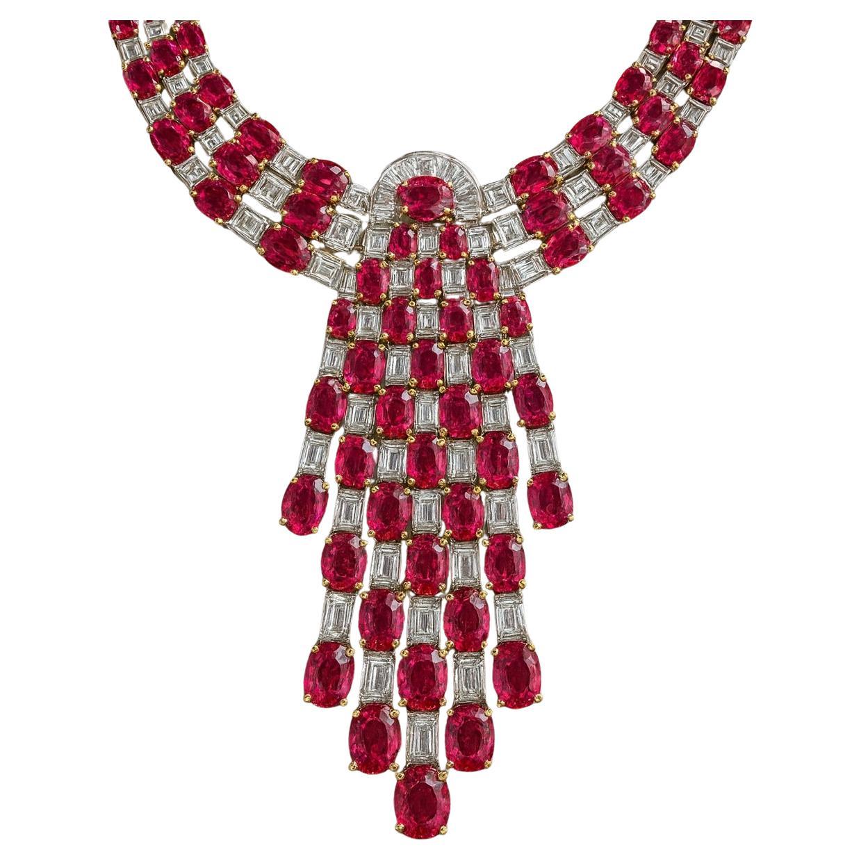 Natural Ruby & Diamond Collar Necklace in 18K Gold – 56 Carats of Rubies & 13 Carats of Diamonds

Finely crafted in solid 18K gold, this bold collar necklace is set with 56 carats of natural rubies and accented by 13 carats of baguette and trapeze