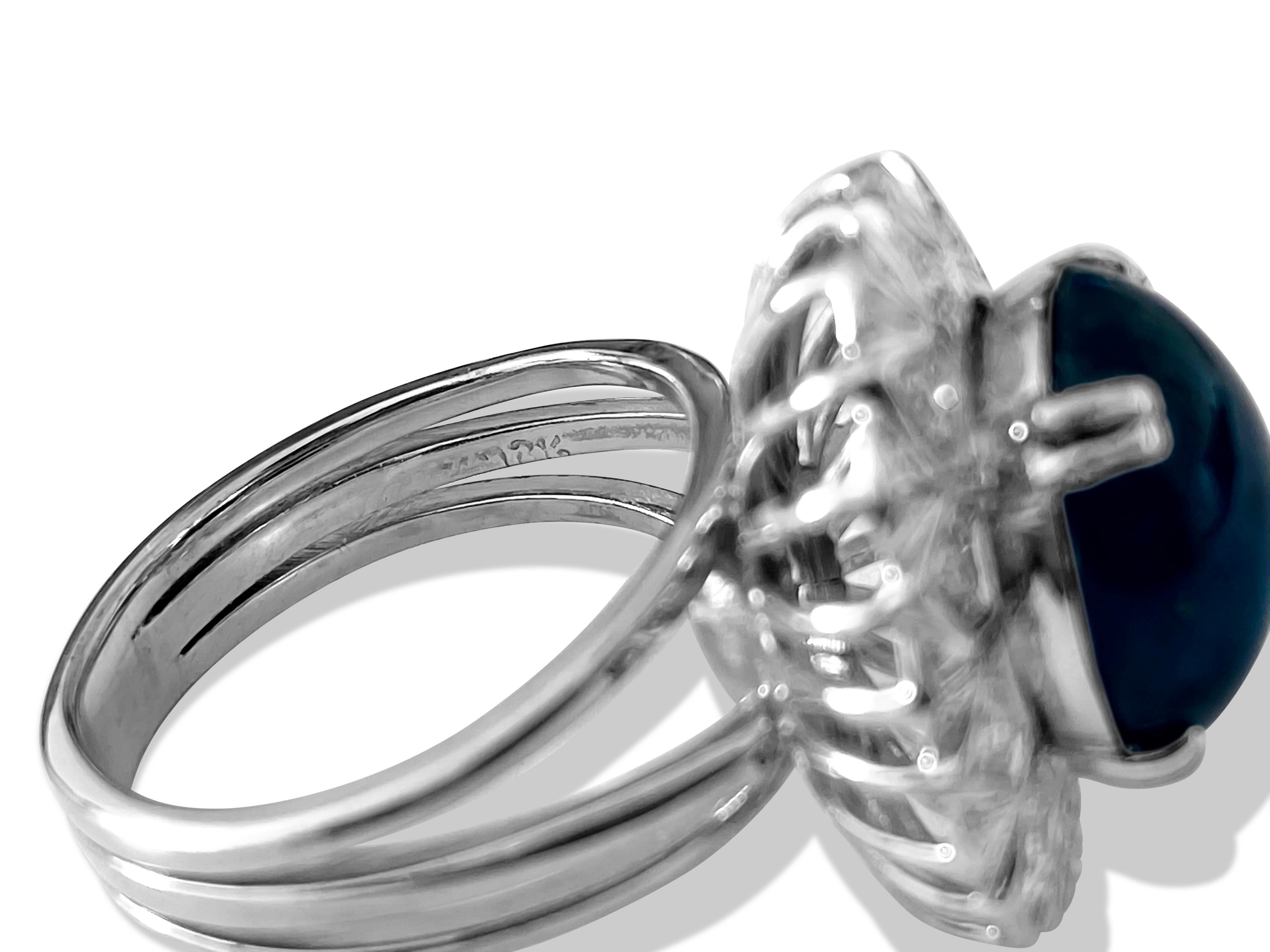 Celebrate timeless elegance with this vintage ladies' ring crafted from 18K white gold, featuring a captivating 6.50 carat cabochon-cut blue sapphire and 0.40 carats of round brilliant-cut diamonds with G color and VS clarity. Both the diamonds and