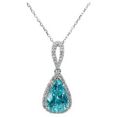 Pendentif en zircon bleu de 6,90 carats, diamants de 0,22 carat et chaîne de 14 carats
