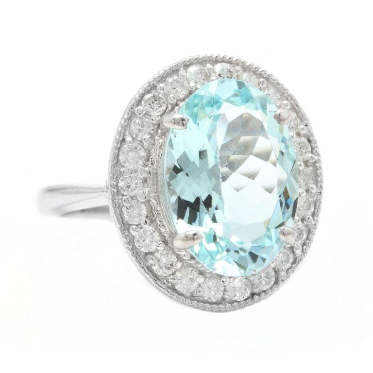 6.90 Carats Natural Aquamarine and Diamond 18K Solid White Gold Ring

Total Natural Oval Cut Aquamarine Weights: 6.00 Carats

Aquamarine Measures: 13.00 x 11.00mm

Natural Round Diamonds Weight: .90 Carats (color G-H / Clarity SI1-SI2)

Ring size: 7