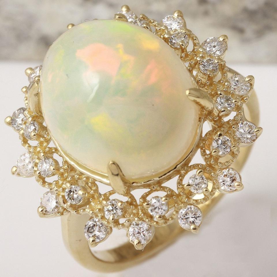 6.90 Carats Natural Impressive Ethiopian Opal and Diamond 14K Solid Yellow Gold Ring

Total Natural Opal Weight is: Approx. 6.00 Carats

Opal Measures: Approx. 15.38 x 12.07mm

The head of the ring measures: Approx. 21.14 x 20.63mm

Total Natural