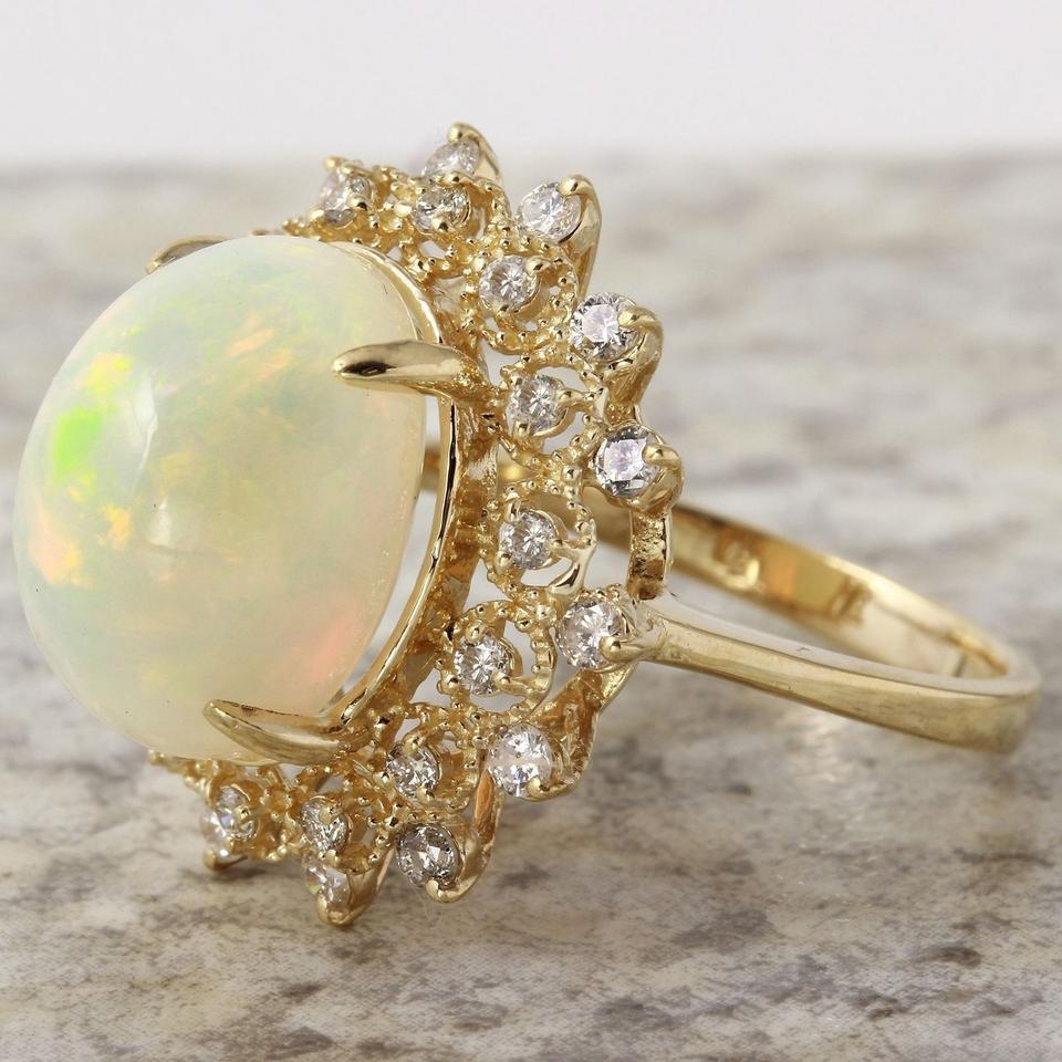 Mixed Cut 6.90 Ct Natural Impressive Ethiopian Opal and Diamond 14 Karat Solid Gold Ring For Sale