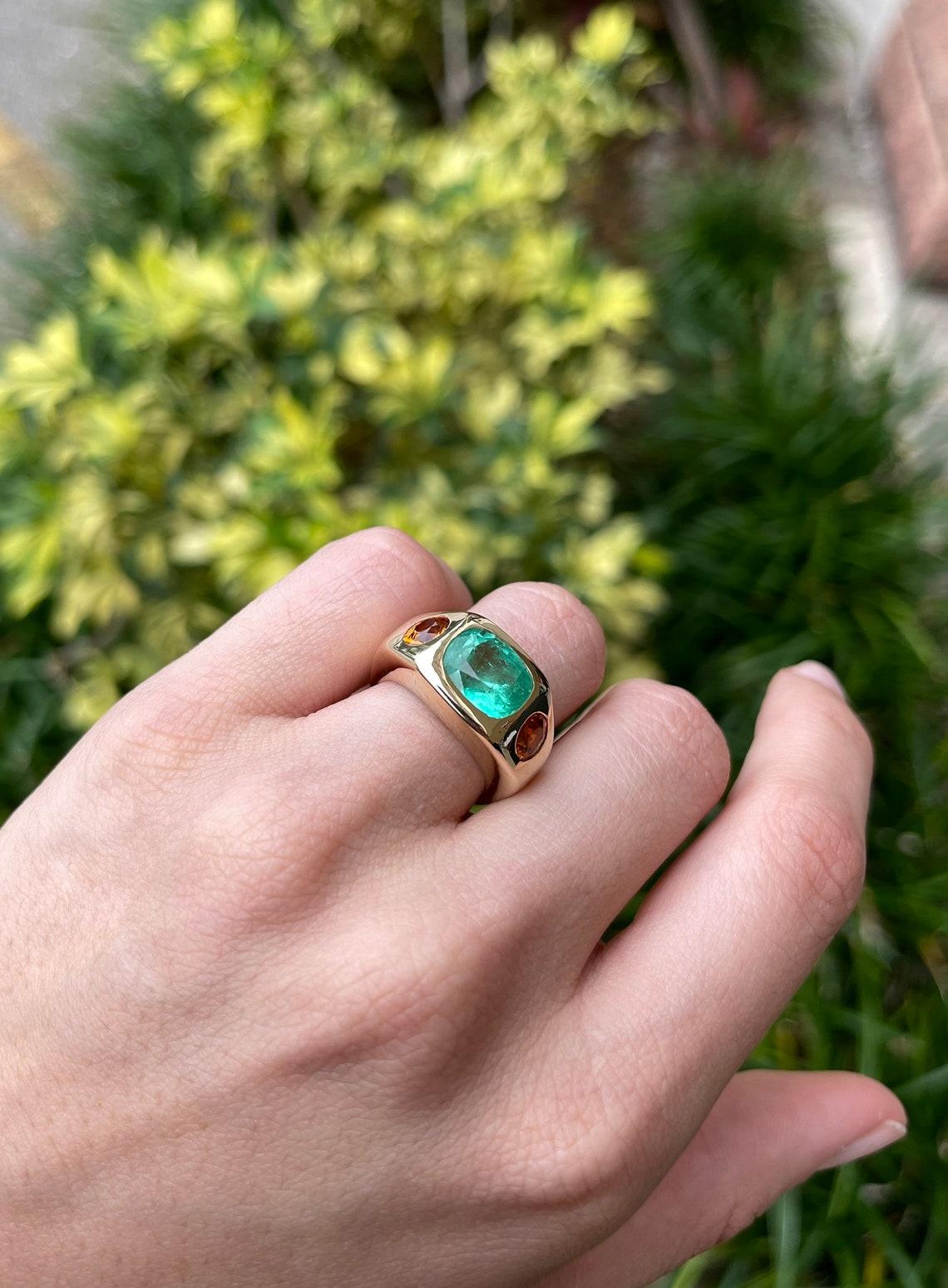 7.05tcw 14K 3 Stone Colombian Emerald & Oval Orange Sapphire Gypsy Bezel Ring In New Condition For Sale In Jupiter, FL