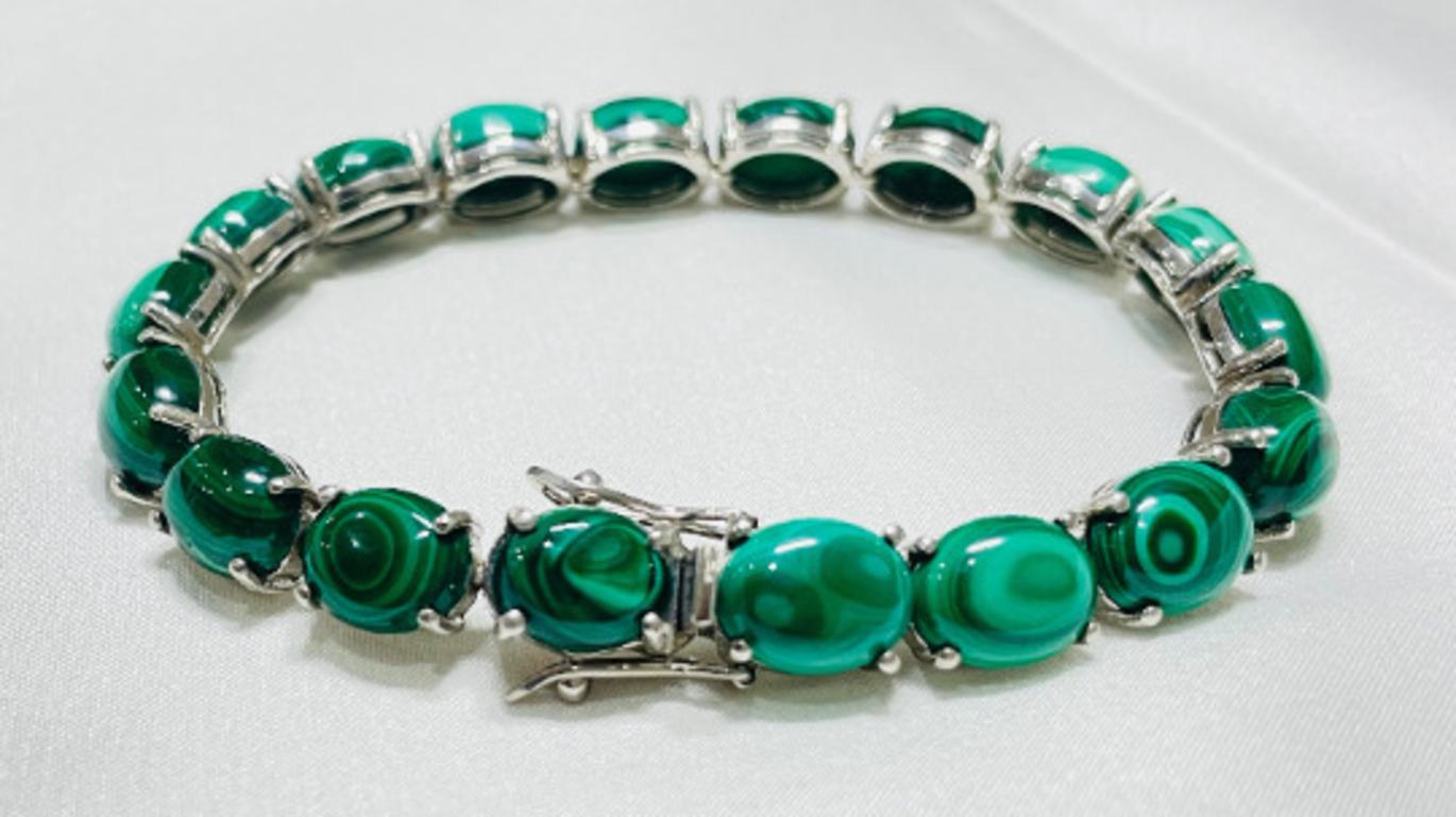 Beautifully handcrafted silver 69.1 Carat Malachite Gemstone Tennis Bracelet, designed with love, including handpicked luxury gemstones for each designer piece. Grab the spotlight with this exquisitely crafted piece. Inlaid with natural malachite