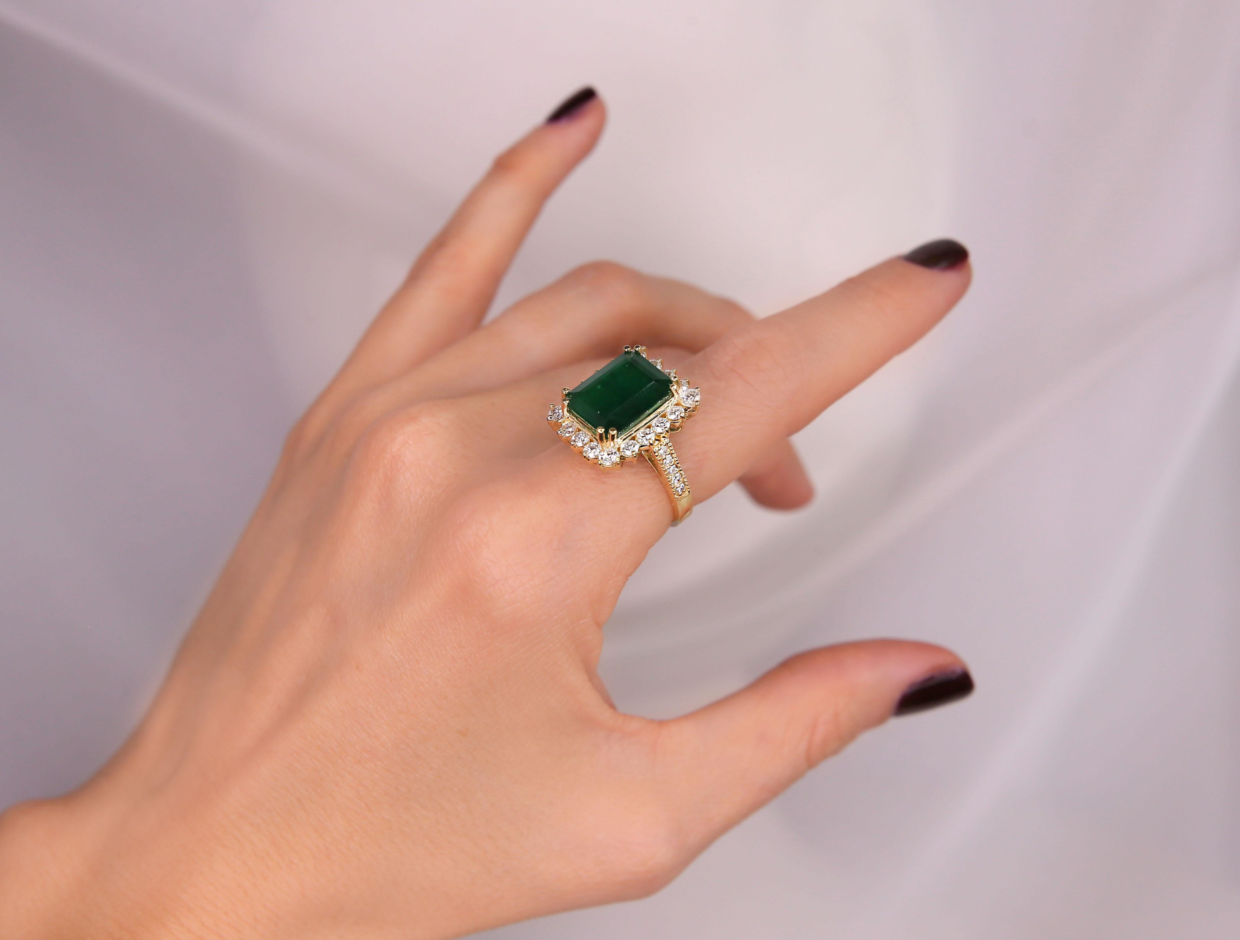 6.91 CTW Emerald 18K Yellow Gold Diamond Ring
Stamped: 18K
Total Ring Weight: 9.2 Grams
Emerald Weight: 5.51 Carat (13.00x11.00 Millimeters)
Diamond Weight: 1.40 Carat (F-G Color, VS2-SI1 Clarity )
Face Measures: 19.20x16.30 Millimeters