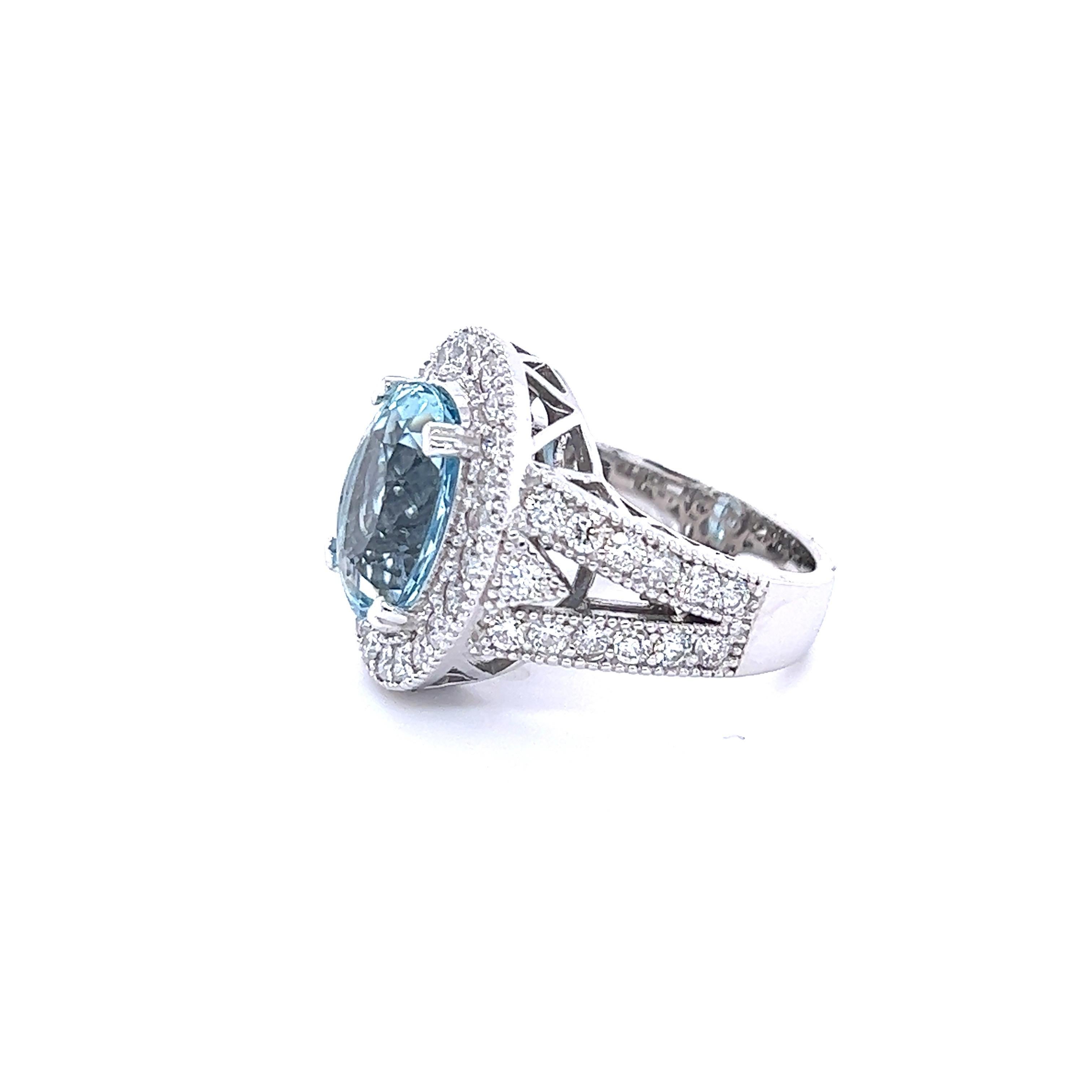 This ring has a beautiful Oval Cut Natural Aquamarine that measure at 13 mm x 10 mm and is 5.15 Carats. It is surrounded by 49 Round Cut Diamonds that weigh 1.77 carat (Clarity: VS2, Color: F). The total carat weight of this ring is 6.92 carats.