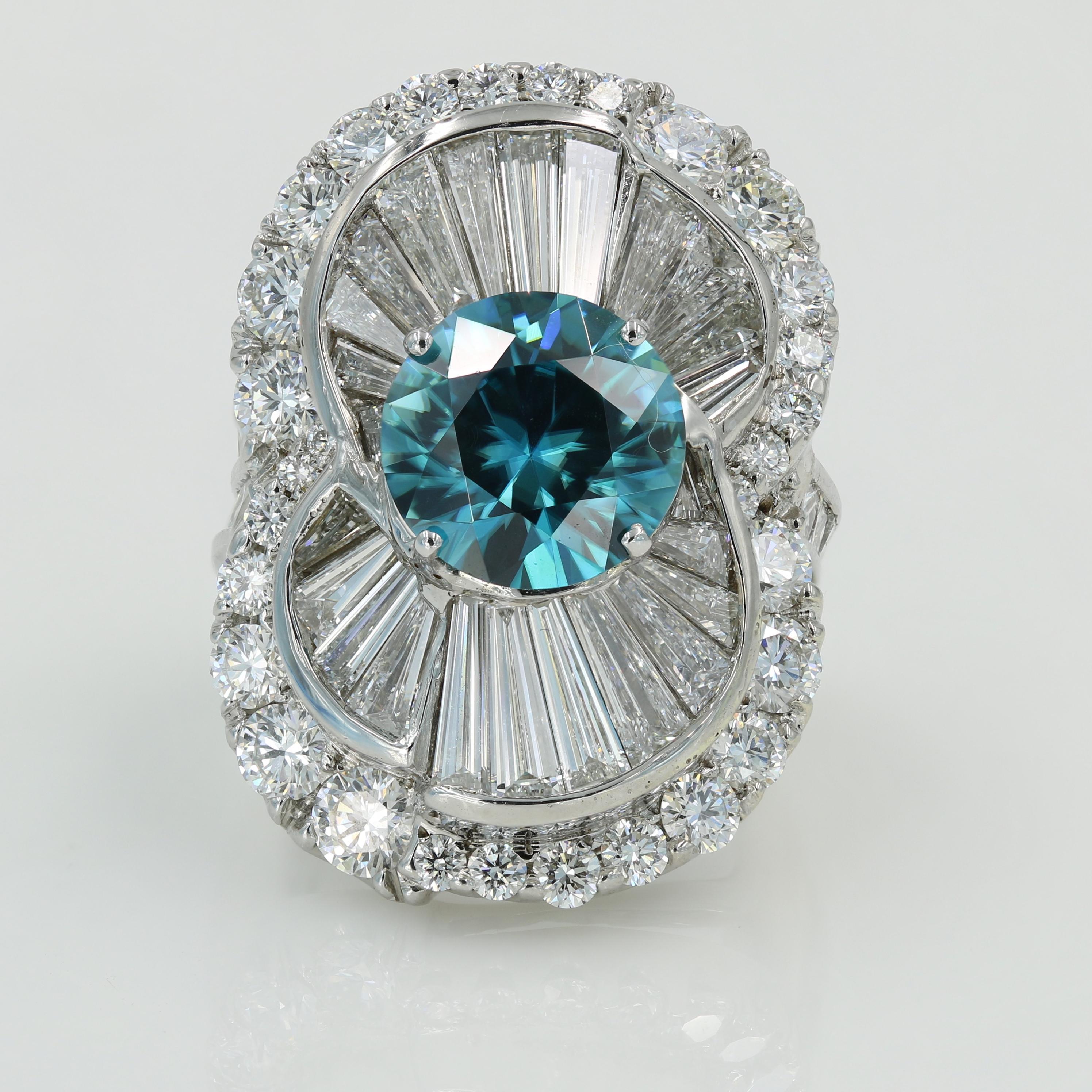 Lester Lampert original design 6.92cts round cut Blue Zircon ring in 18kt white gold set with 24 very large taperer Baguette cut diamonds weighing 3.68cts total, 20 Princess cut diamonds weighing 1.71cts total & 32 Ideal cut Round diamonds weighing