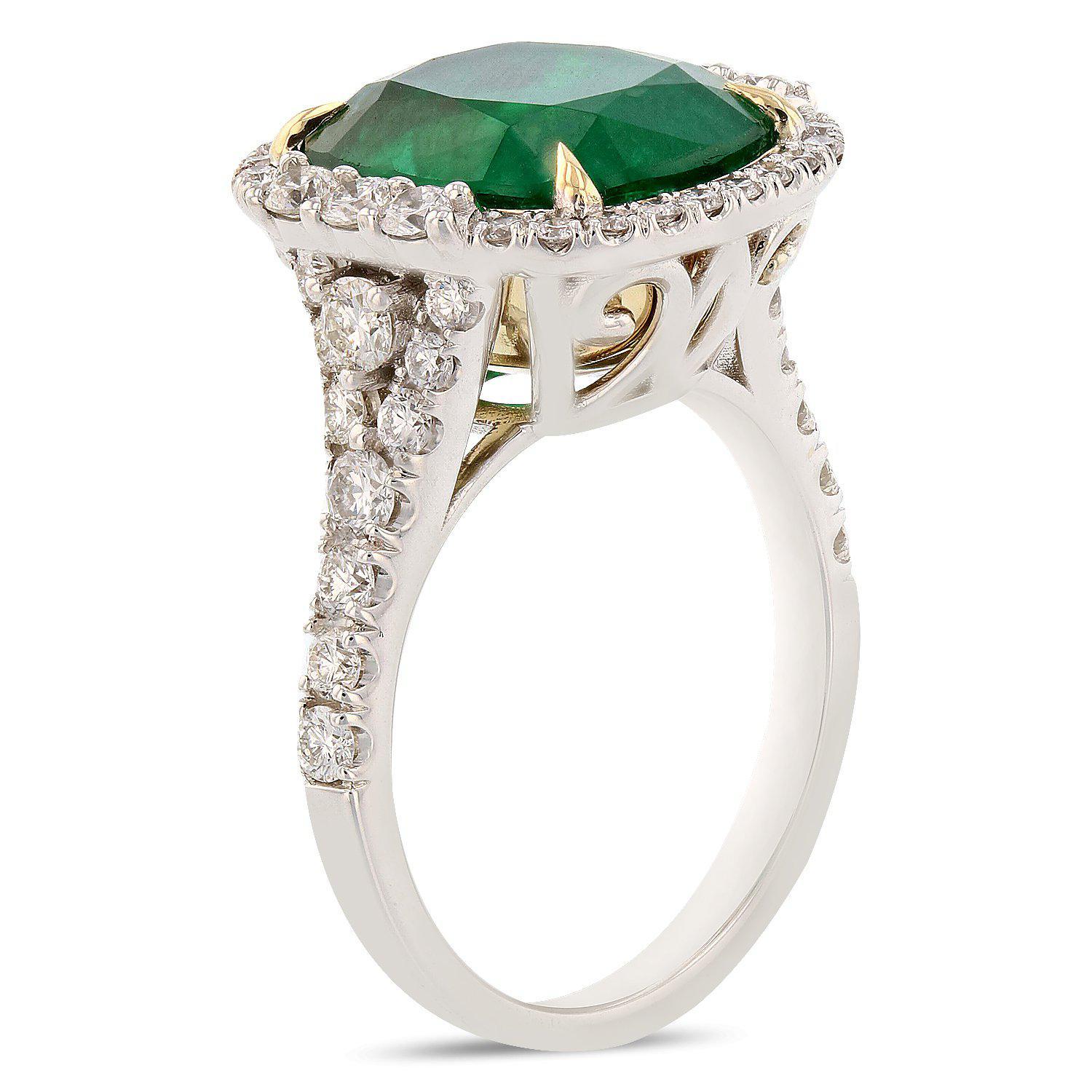 One electronically tested 18KT white gold ladies cast and assembled emerald and diamond ring with a bright finish. Condition is new, good workmanship.

 

The featured emerald is set in a yellow gold basket within a diamond bezel, supported by an