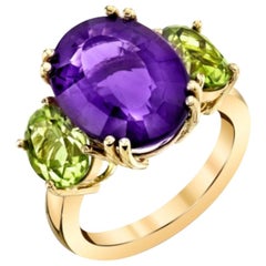 6.93 Carat Oval Amethyst and Peridot Yellow Gold Three-Stone Cocktail Ring