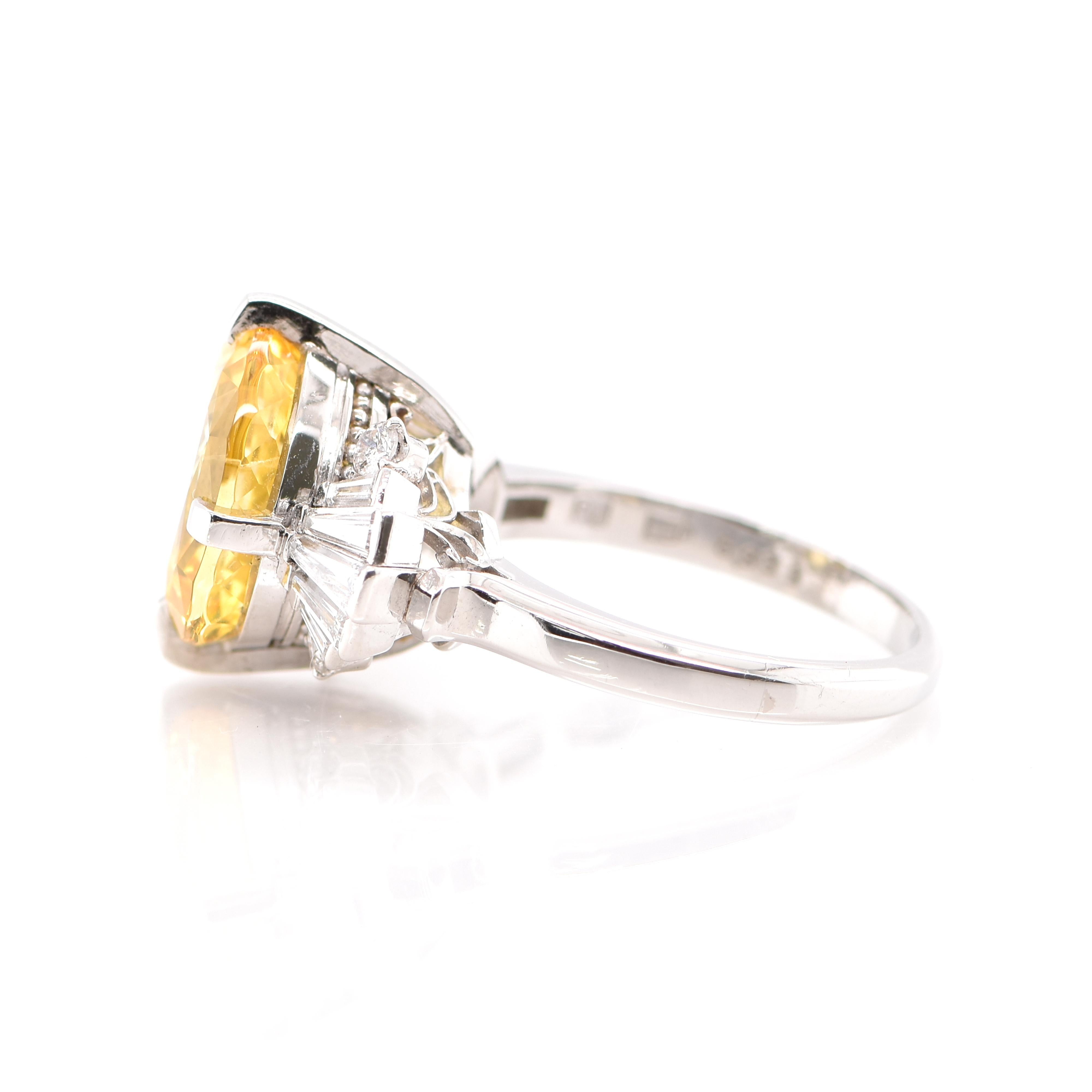 Oval Cut 6.93 Carat Untreated Yellow Sapphire and Diamond Ring Set in Platinum