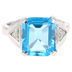 Bague en or blanc 14 carats avec topaze bleue de 6,94 carats et diamants