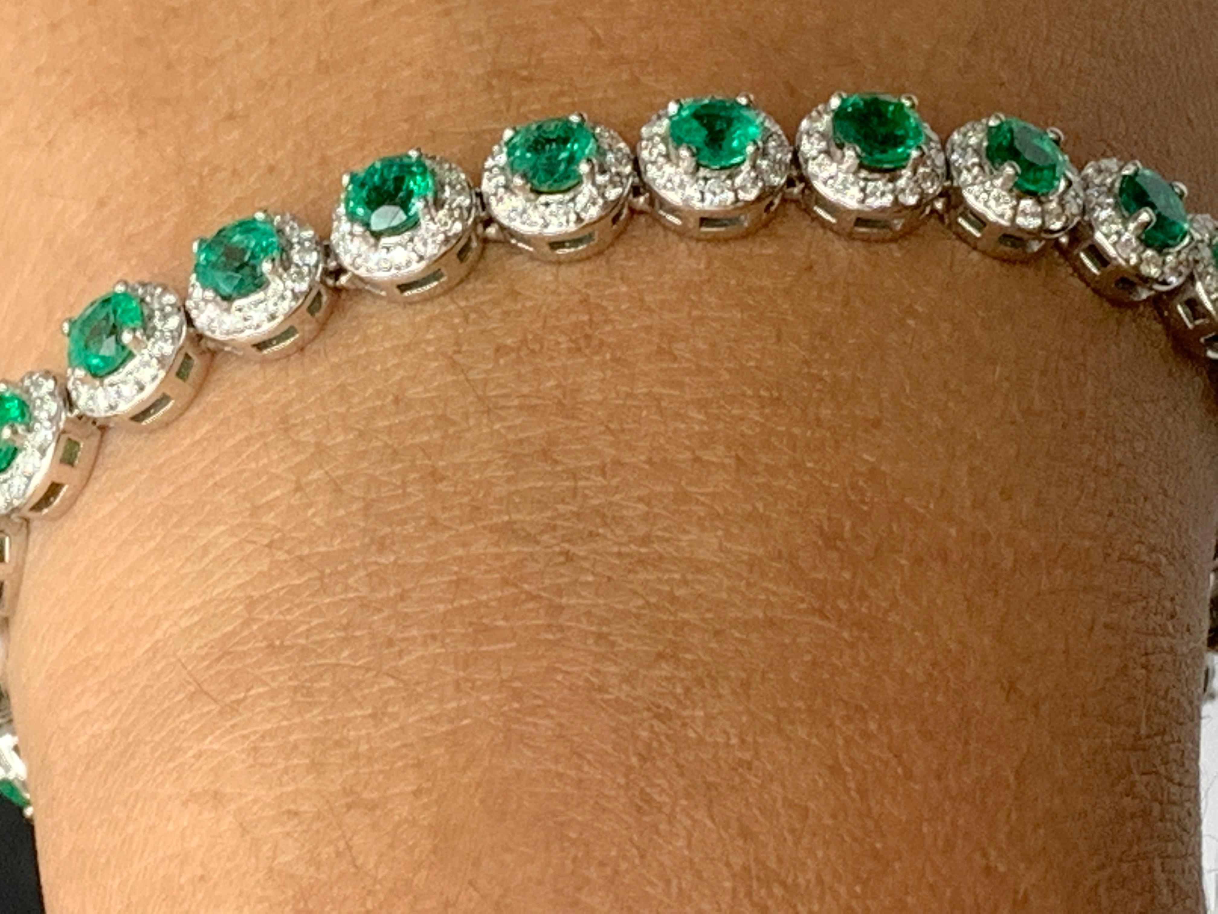 This gorgeous bracelet features 26 round brilliant emeralds weighing 6.94 carats total. Each stone is surrounded by a single row of small round 338 diamonds weighing 2.31 carats total. Set in 14k white gold.

Style available in different price