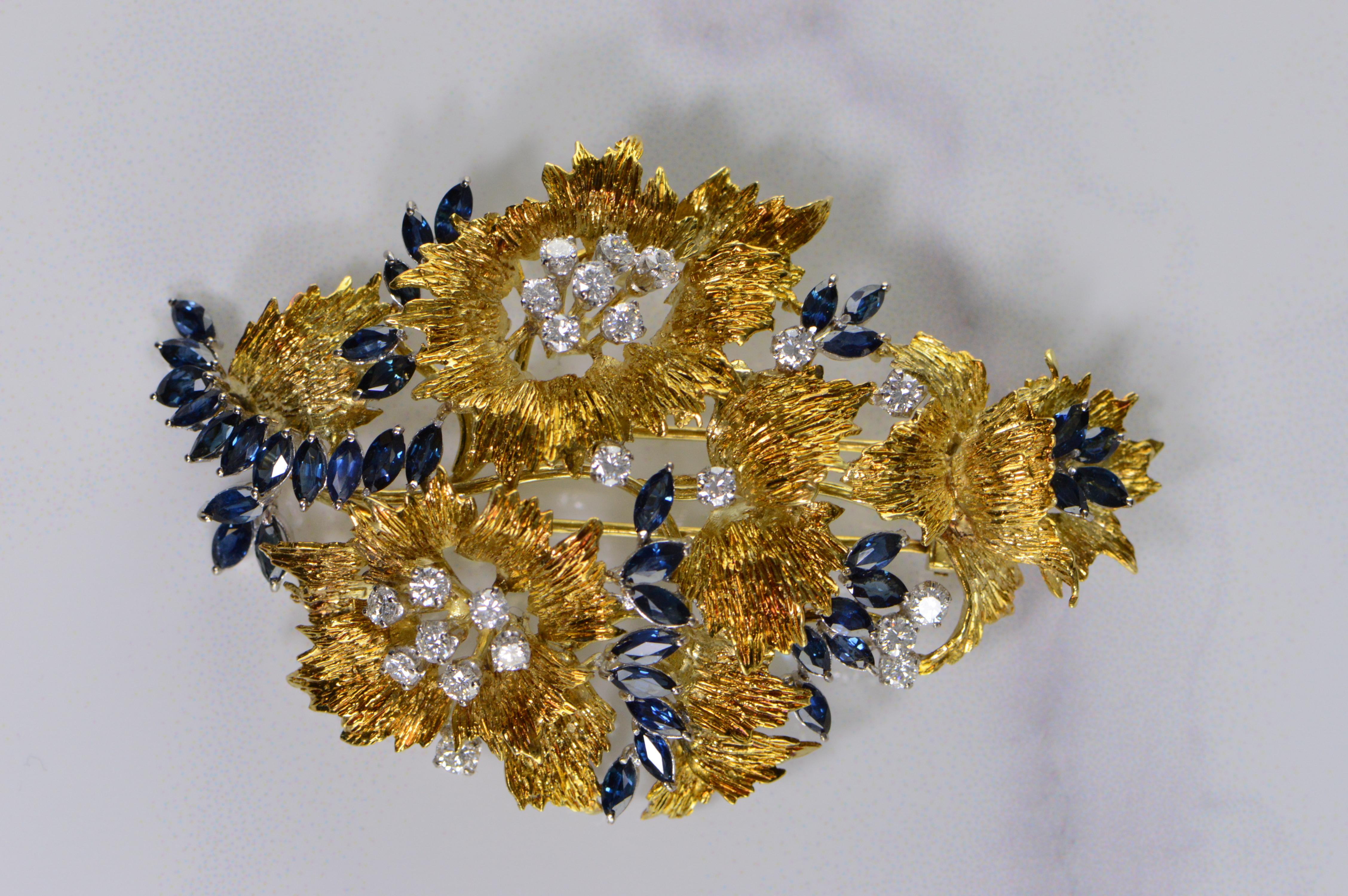 6.94 Ctw Marquise Sapphire Diamond Floral Pin/Brooch - Marquise Sapphire-(5.20 ctw, 40x) & Round Brilliant Cut Diamonds-(1.74 Ctw, 21x)  set in 18K yellow gold with 44.3 grams in weight. This is currently a pin however it could easily be converted