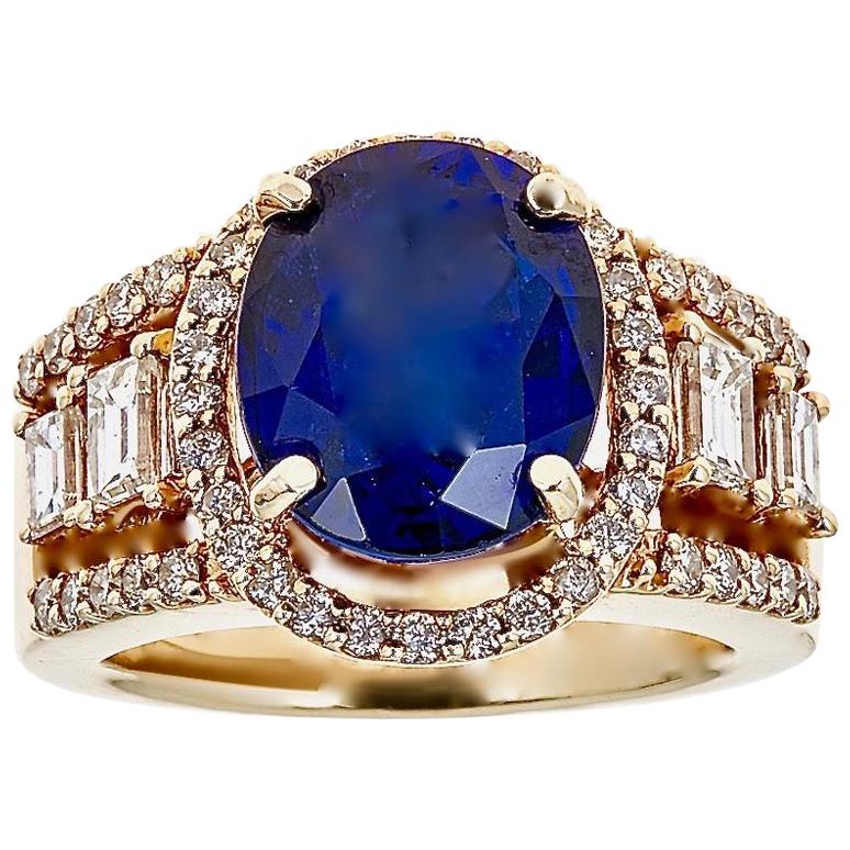 6.95 Carat Oval Tanzanite and Baguette Diamond Antique Ring in 14 Kt Yellow Gold