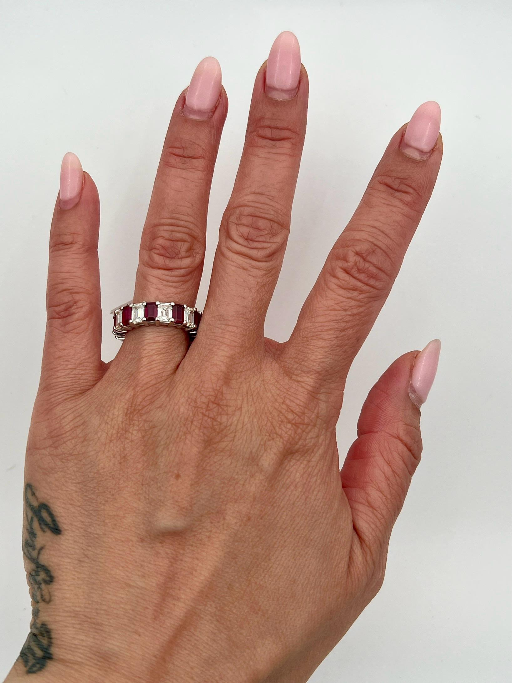 A natural emerald cut ruby and diamond eternity band is a stunning and timeless piece of jewelry that is perfect for any occasion. The striking combination of the deep red ruby and the brilliant diamonds creates a mesmerizing effect that catches the