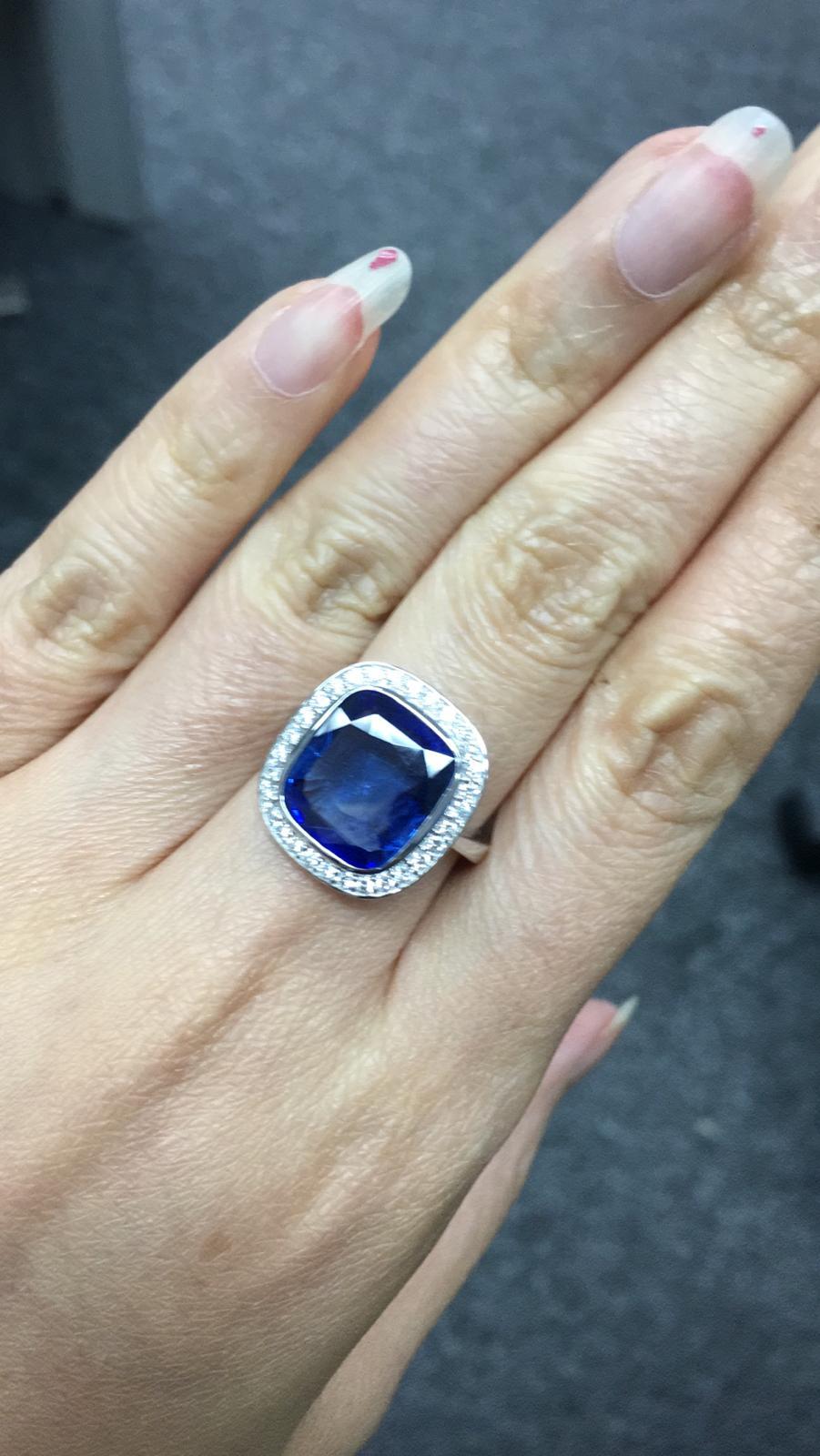 Primary Stone: Sapphire ( Sri Lanka )
Shape : Cushion Cut
Sapphire Weight: 6.96 Carats (1 Sapphire)
Measurements Sapphire: 12.26 mm x 11.00 mm x 4.82 mm
Color: Vivid Blue
Accent Stones: Genuine Diamond
Shape Or Cut Diamond: Round Brilliants
Average