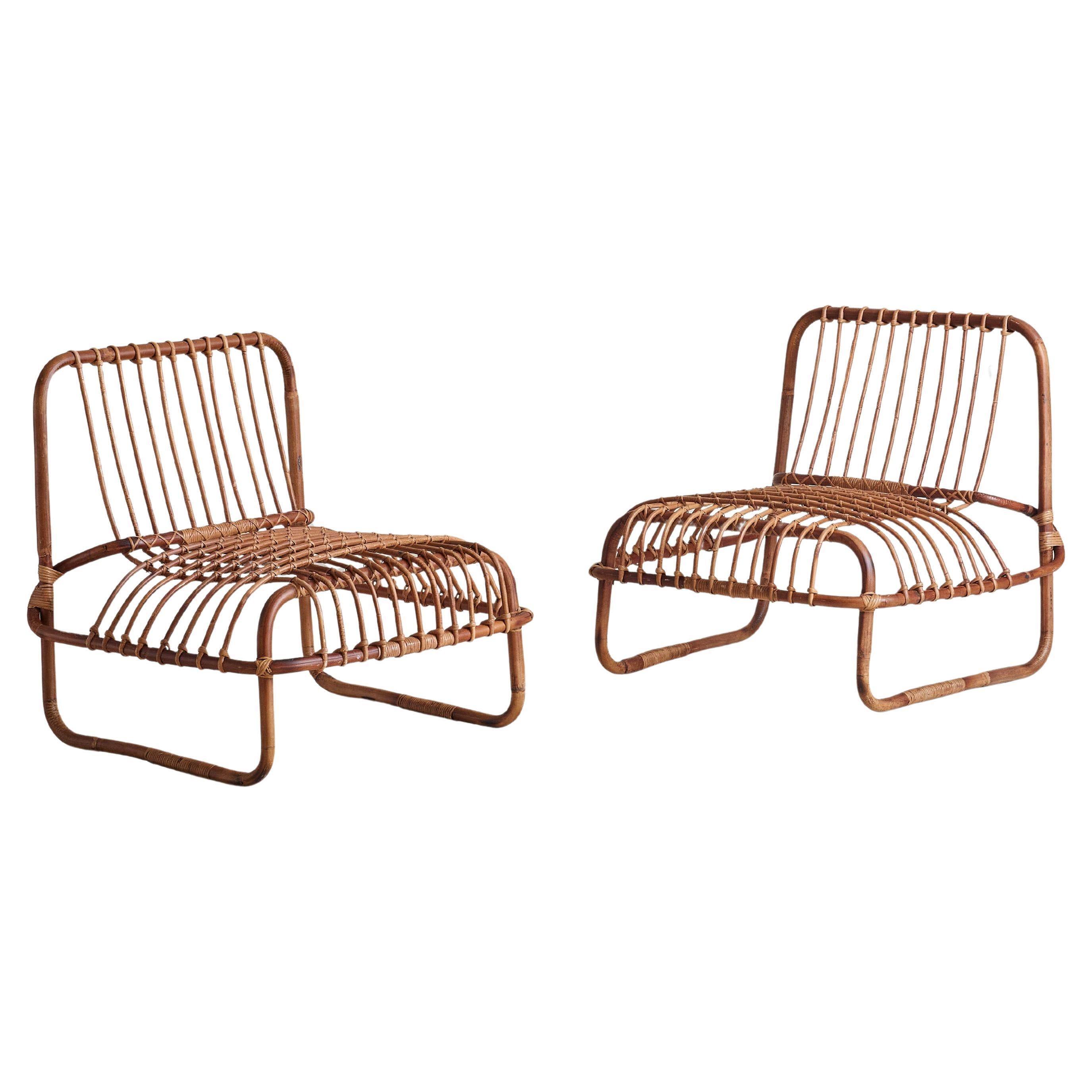 Sold and priced individually.

The '697’ armchair was designed by Raffaella Crespi for Vittorio Bonacina in 1964. Constructed with a rattan frame and handwoven cane, this chair is a sculptural, collectible piece. Its open, lightweight design