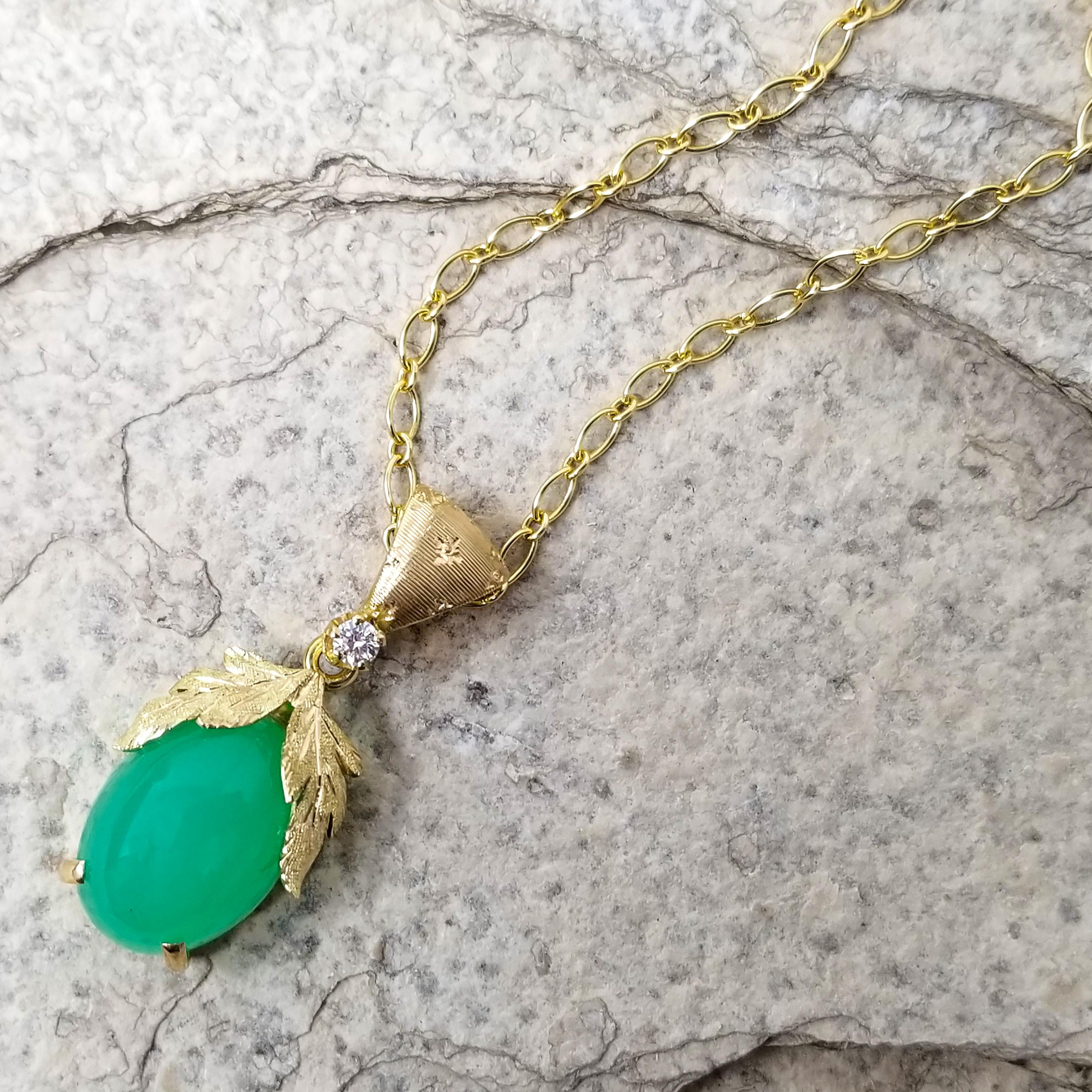 The vivid apple green of this exquisite chrysoprase is breath-taking in its intensity. The soft translucence allows the light to play through the gemstone.

The Sylvia pendant embraces this carefully chosen gemstone in richly detailed, Florentine