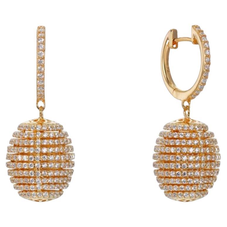 A stunningly unique composition, these white beehive style earrings feature intricately designed cubic zirconia set in circular rows.

Finished with imprints of flowers to the top and underside of the drop.

Handcrafted in 925 sterling silver with a
