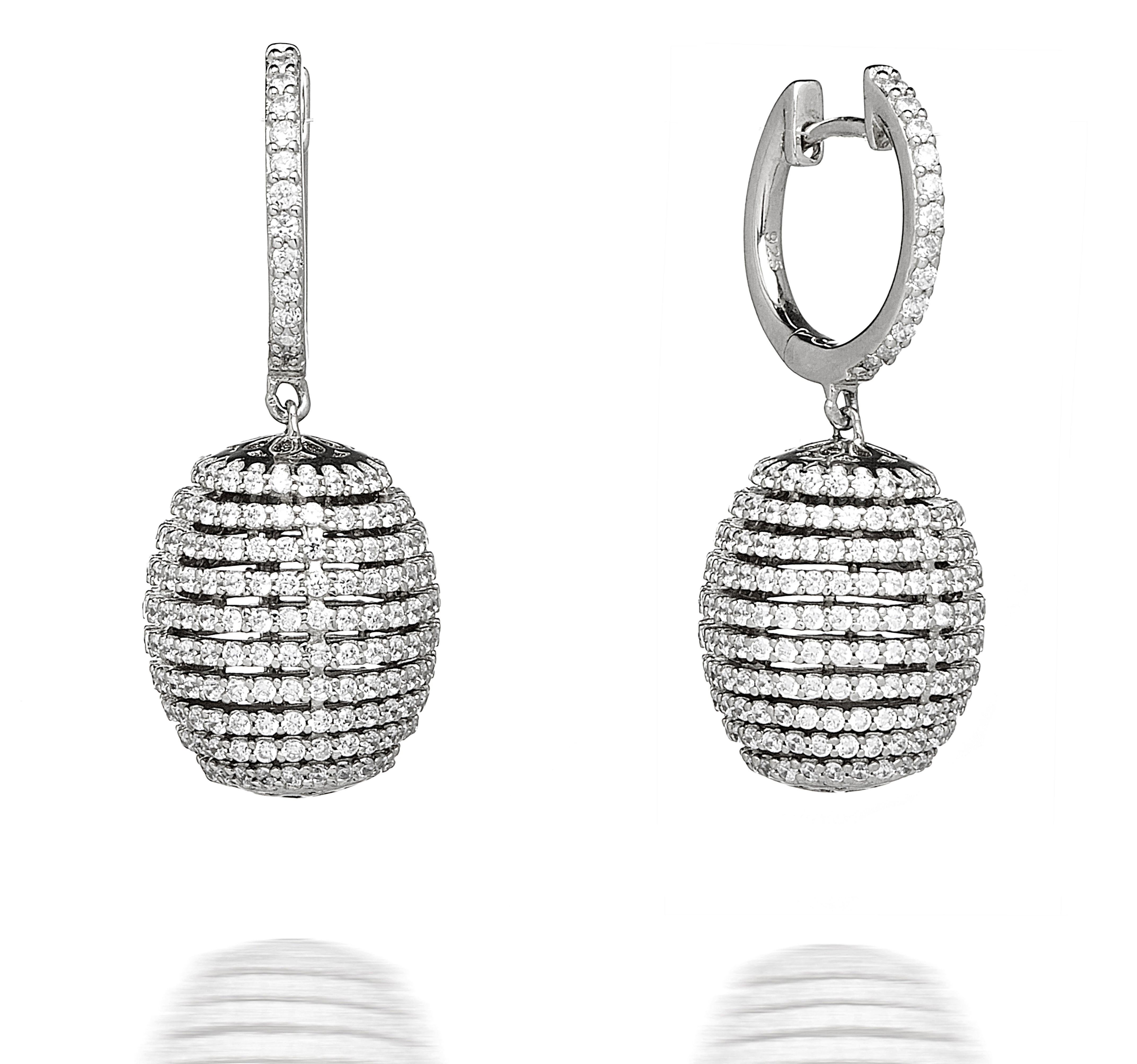 A stunningly unique composition, these white beehive style earrings feature intricately designed cubic zirconia set in circular rows.

Finished with imprints of flowers to the top and underside of the drop. Handcrafted in 925 sterling silver with a