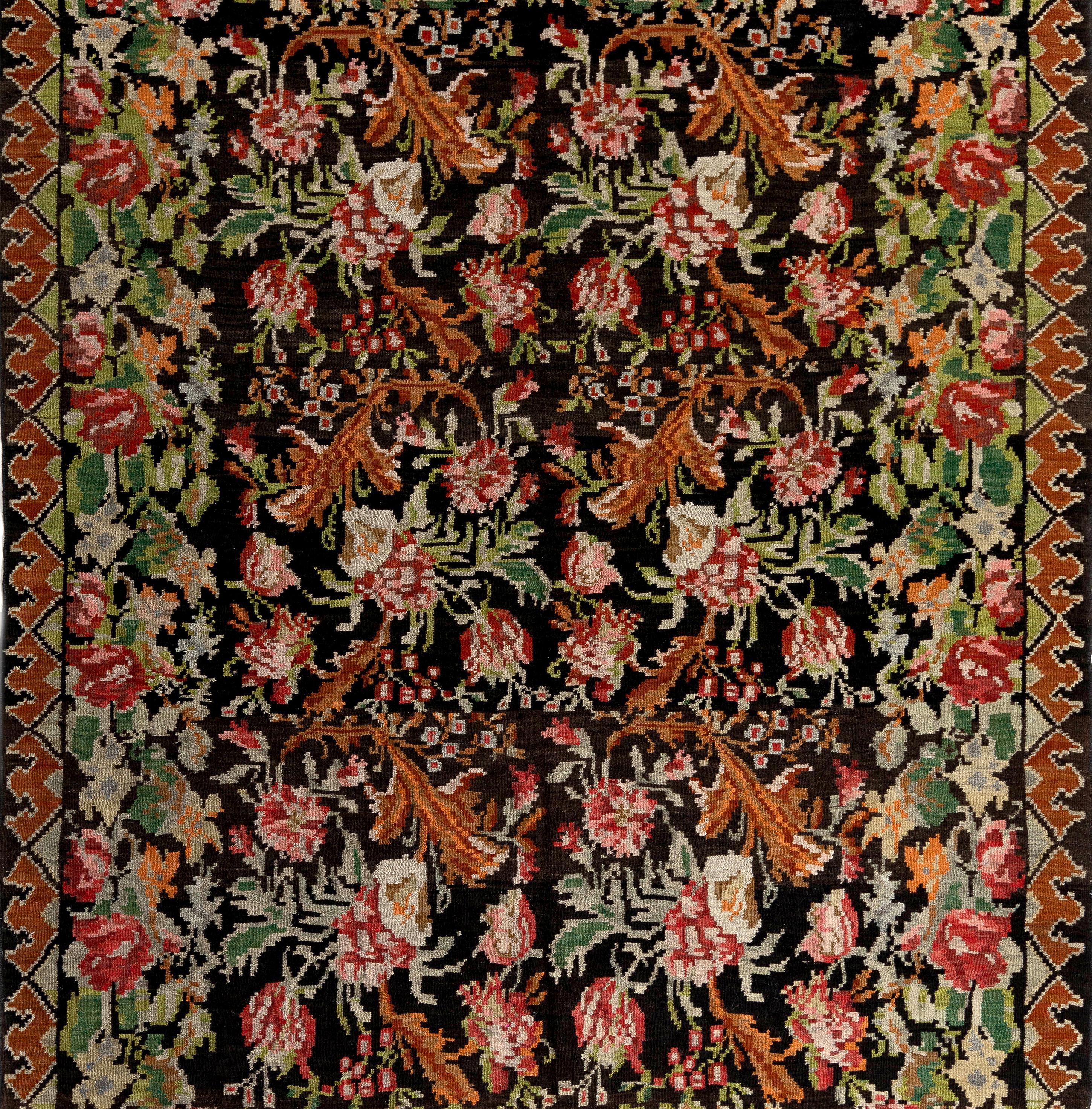 One of a kind vintage Bessarabian Kilim.
A handwoven Eastern European rug from Moldova. These traditional Moldovan flat-weaves are inspired from vintage Aubusson carpets but they are distinguished with their black grounds, large floral patterns in