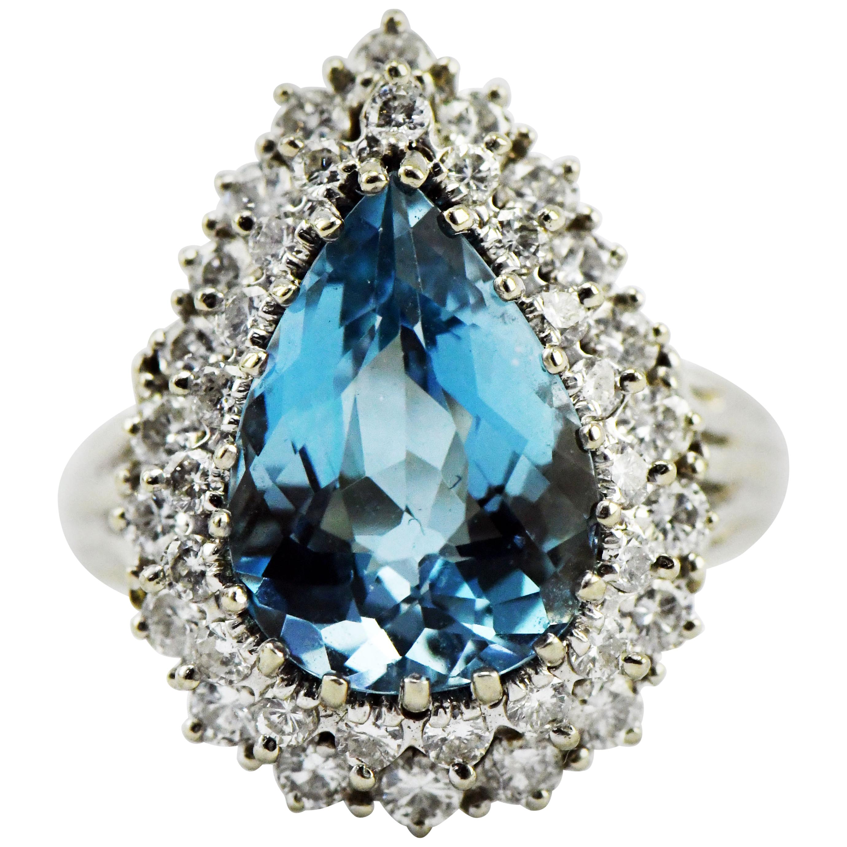 6 Carat Blue Pear Cut Topaz and 41-1.25 Carat Diamonds 14K Gold Cocktail Ring For Sale