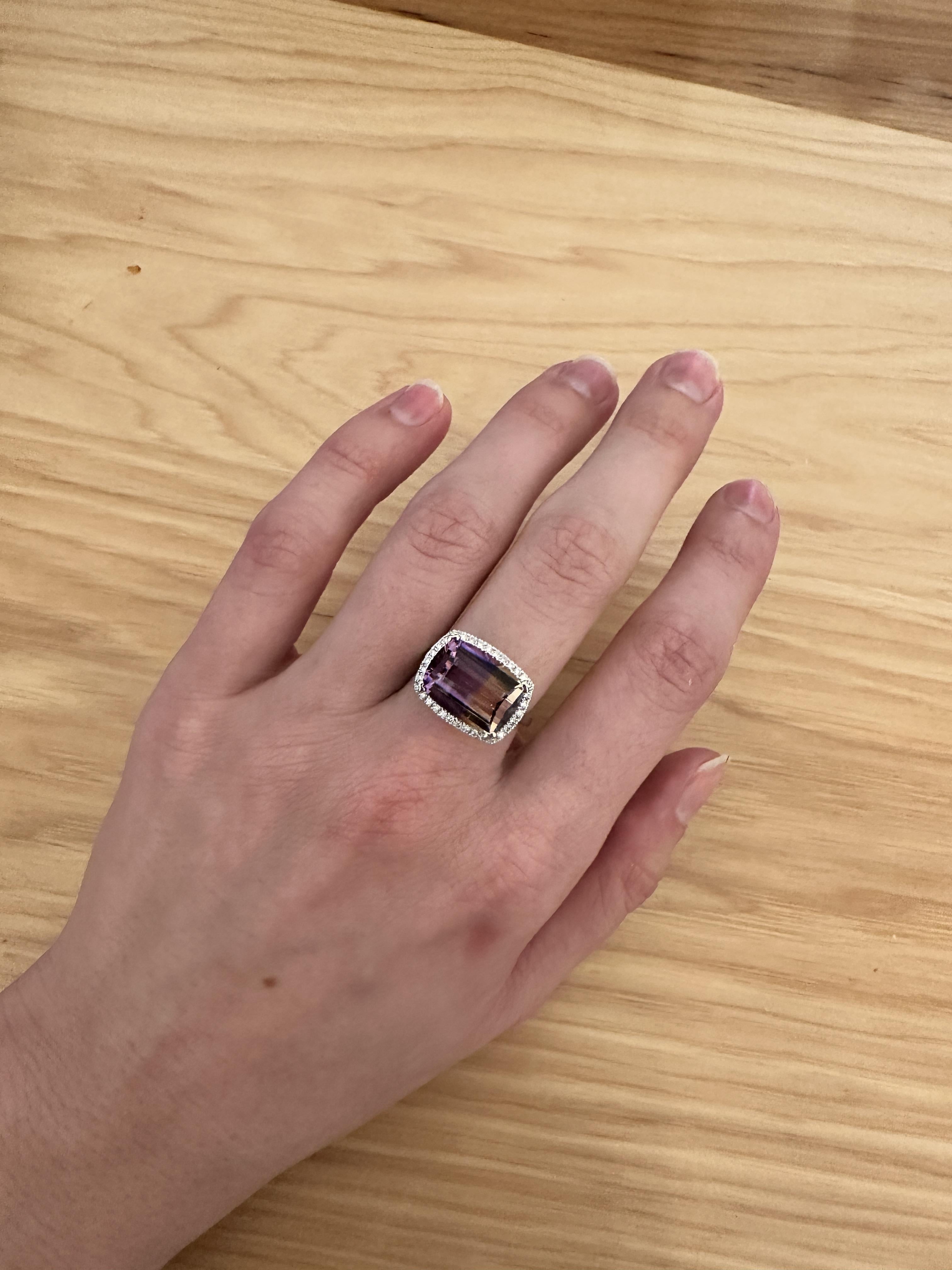 Make a statement with this 6.09ct Ametrine ring. Featuring a gorgeous barrel cut cushion 14x10mm Ametrine gemstone and a sparkling earth mined diamond halo, this ring is set in solid 14K white gold for a touch of elegance.

**We offer complimentary