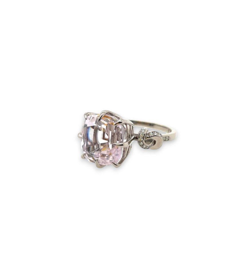 Glamorously bold and unabashedly seductive. The Forget Me Knot features pastel pink Kunzite poised between eight sharp eagle style talons and embraced by glorious gold ropes, converging to two knots on either side of the luscious, one-of-a-kind