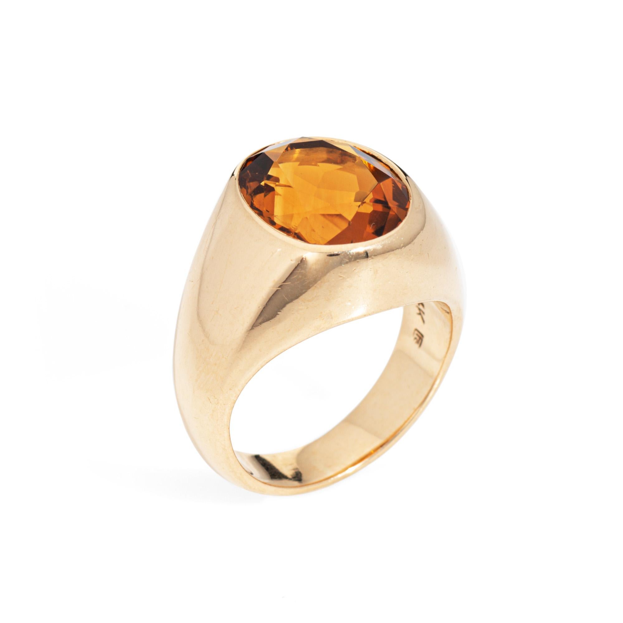 Stylish vintage Maderia Citrine signet ring crafted in 14 karat yellow gold (circa 1980s).

Oval faceted mederia citrine measures 14mm x 11mm (estimated at approx. 6 carats). The citrine is in very good condition with a few small surface blemishes