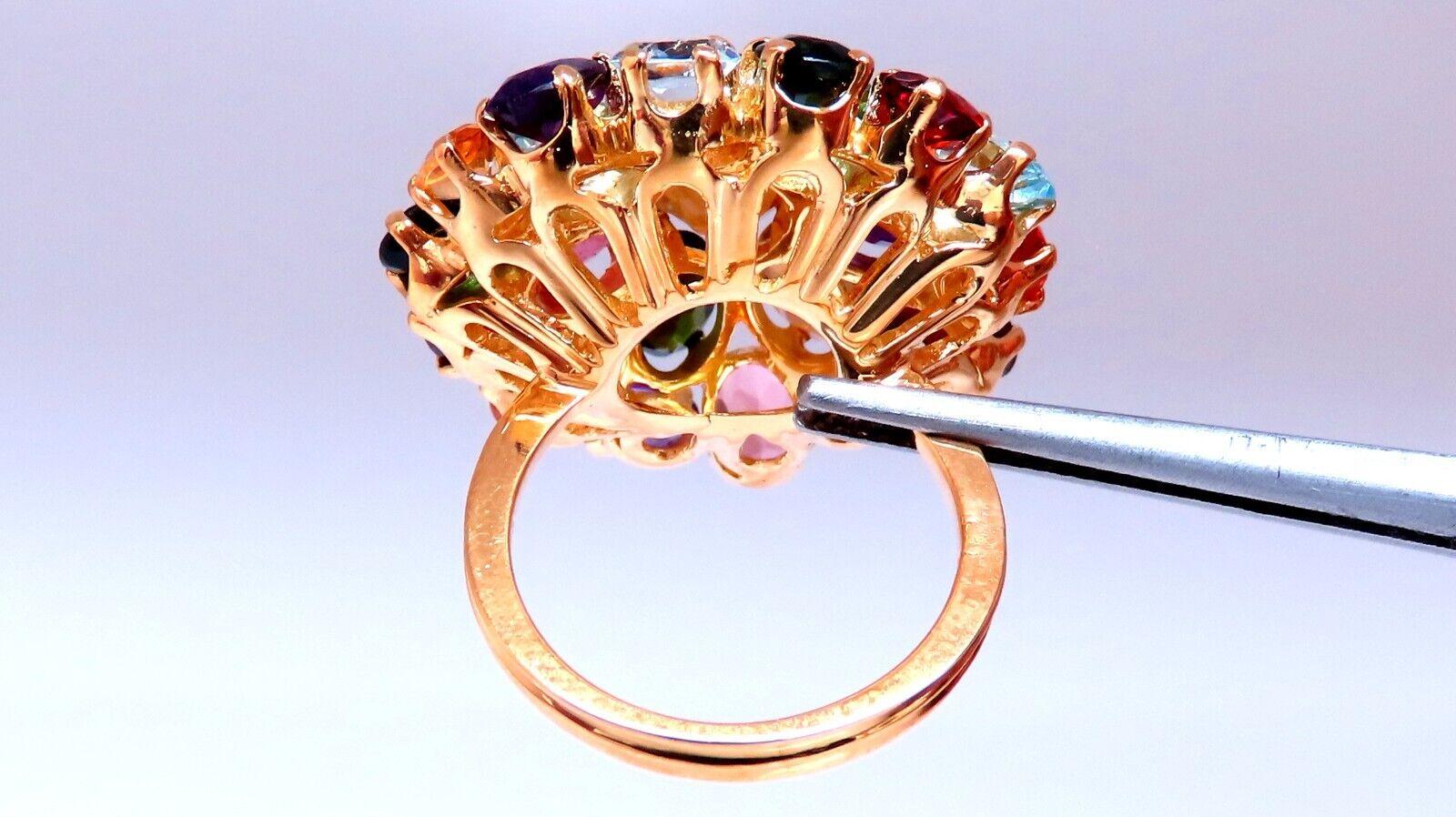 Cocktail ring.

Selection of various gem stones.

Citrine, Aquamarine, sapphire and amethysts

 14kt yellow  gold 12.9 grams

Depth of ring 11 mm

26mm wide ring

Size 6 and with may resize