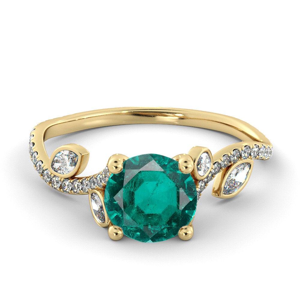 A beautiful handmade engagement ring made of 14K Rose Gold set with a 6mm Emerald adorned by 1/2 carat of natural diamonds. The Emerald in this ring is lab created.
This ring can be set with any stone you choose or in any carat weight.
 
 Main