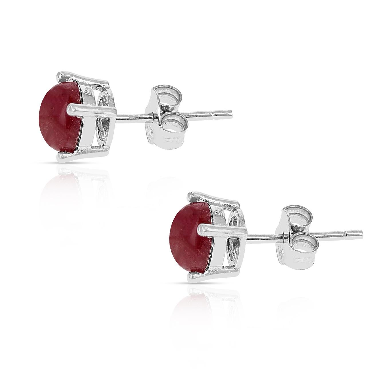 A pair of 6MM Genuine Ruby Round Cabochon Stud Earrings made in Sterling Silver. The total stone weight is approximately 2.30 carats.