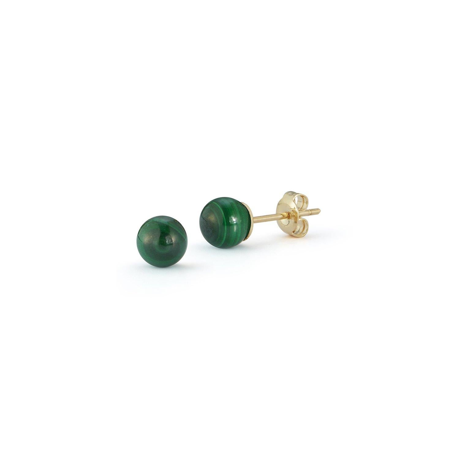 A timeless classic, our malachite studs are a must have and the perfect way to add a bit of color. Made in New York of solid 14kt Gold and natural vivid green malachite with incredible marbling.  
