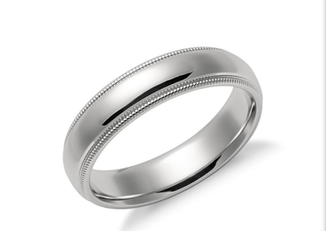 6MM WIDE MILGRAIN EDGE Platinum Plain Wedding Band Ring 8.8 Grams, COMFORT FIT
This men’s or unisex  wedding band, crafted in Platinum , measures 6 mm in width and  2.4 mm thickness is a size 4.5
 It weighs 14.5 grams.
Comfort fit with round
