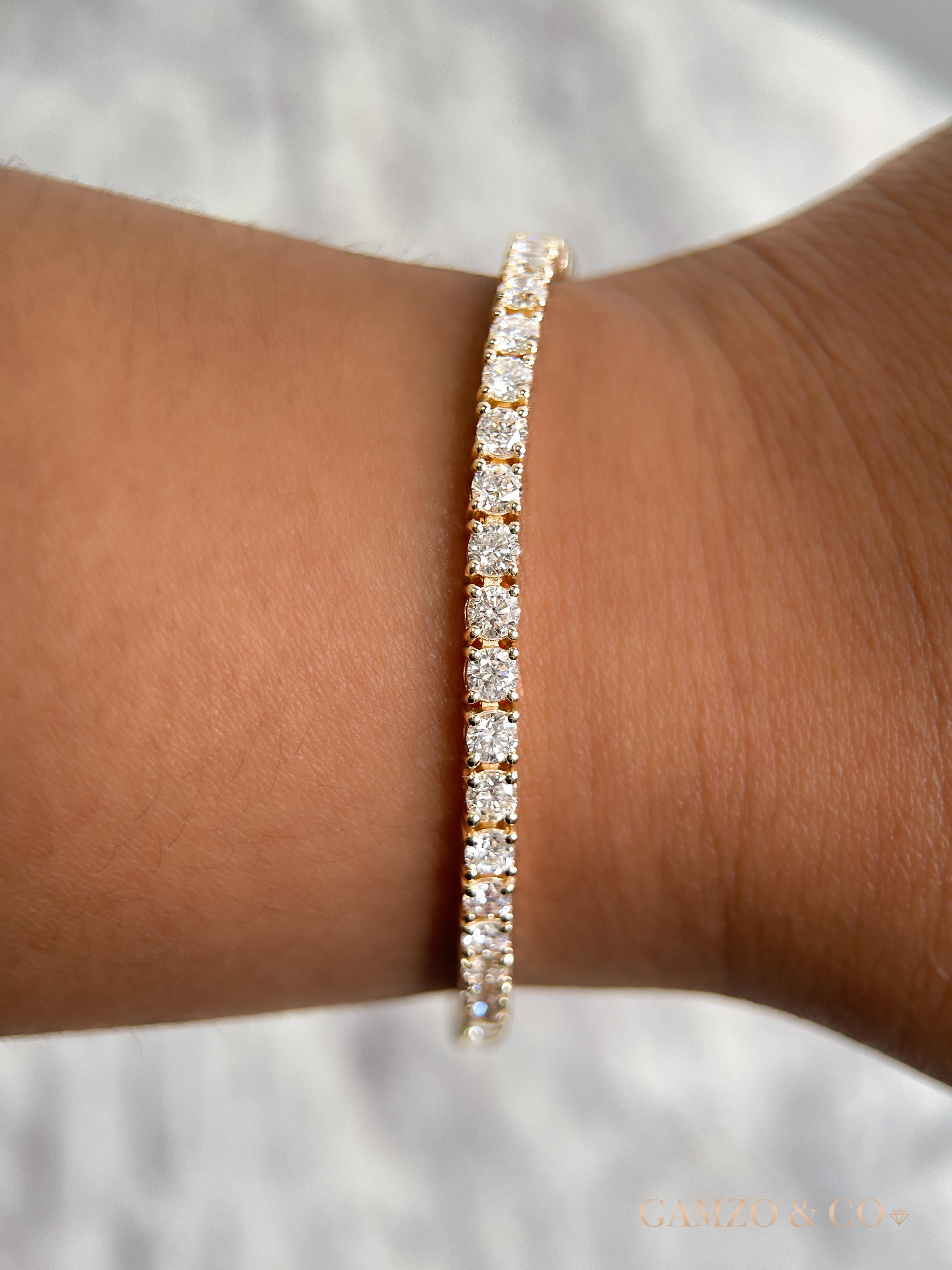 This diamond tennis bracelet features beautifully cut round diamonds set gorgeously in 14k gold.

Metal: 14k Gold
Diamond Cut: Round Natural Diamond 
Total Diamond Carats: 7ct
Diamond Clarity: VS
Diamond Color: F-G
Color: Rose Gold
Bracelet Length: