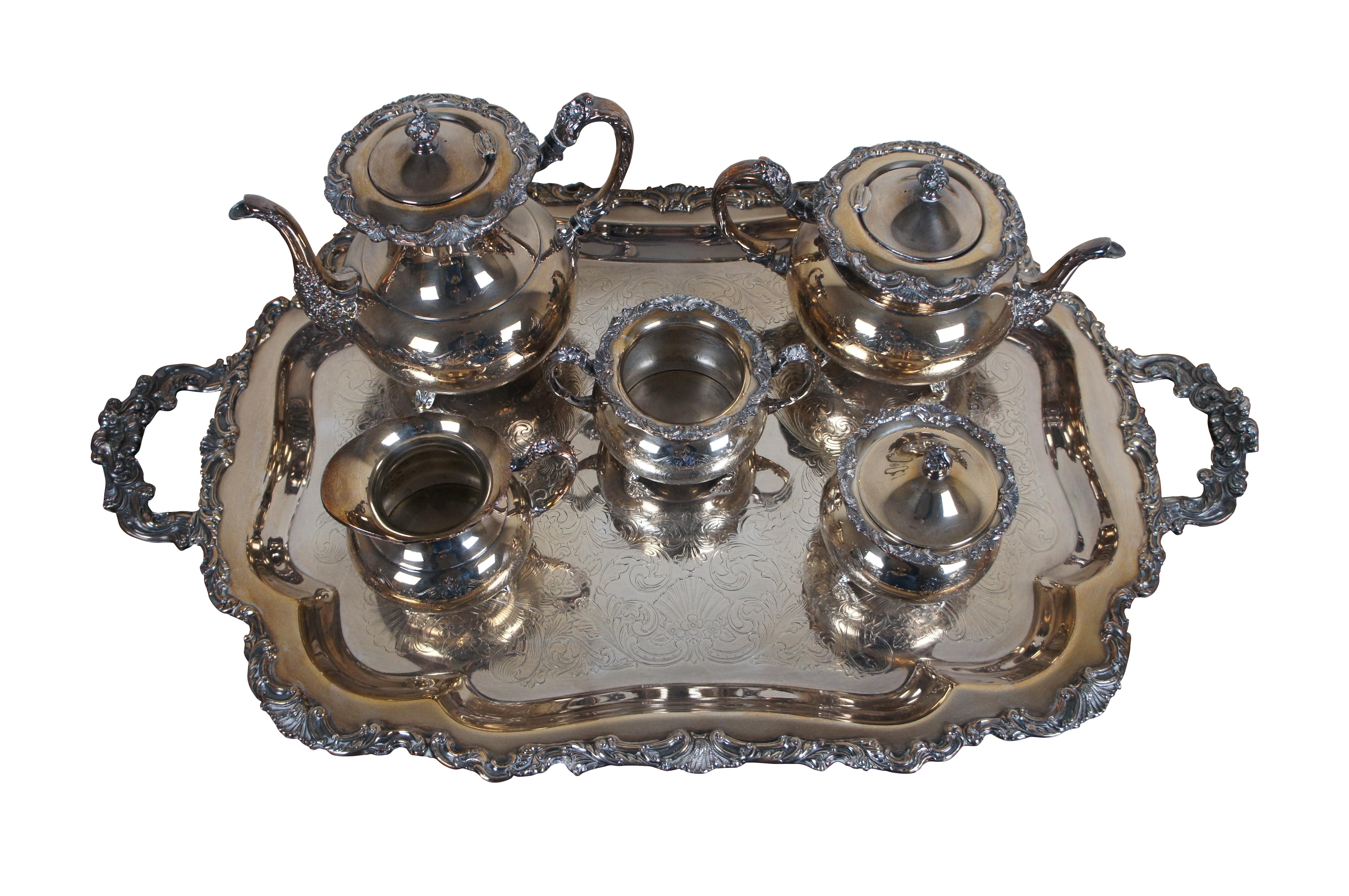 Mid century 6 piece Sheffield Design Reproduction by Community silver plate tea set, including  a large handled / footed tray, tea pot and coffee pot with hinged lids, cream pitcher, waste pot, and lidded sugar bowl. Decorated with molded and etched