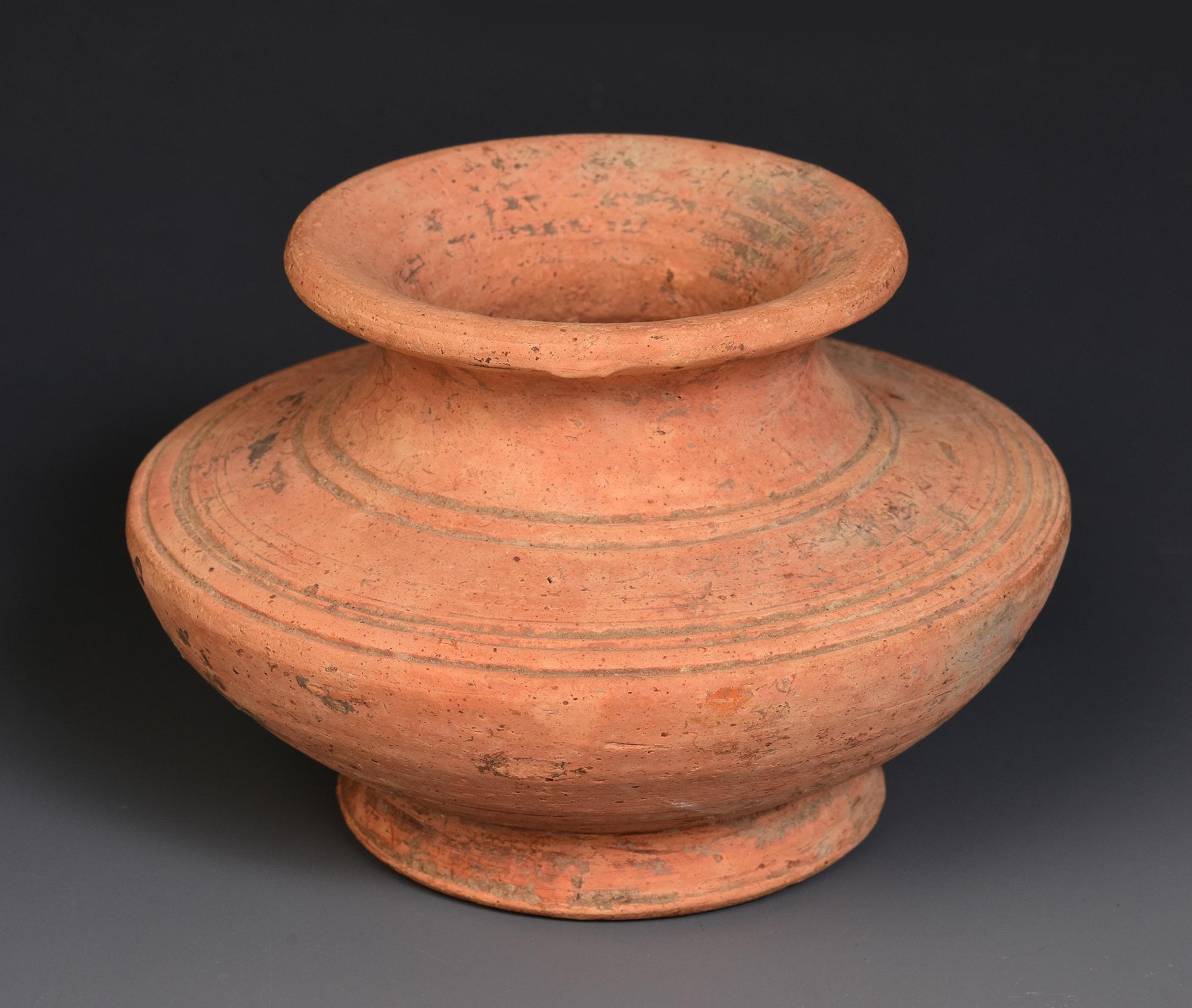 Antique Khmer pottery jar.

Age: Cambodia, Pre-Angkor Period, 6th - 7th Century
Size: Height 7.6 C.M. / Width 11.2 C.M.
Condition: Nice and condition overall (some expected degradation due to its age).

100% satisfaction and authenticity guaranteed