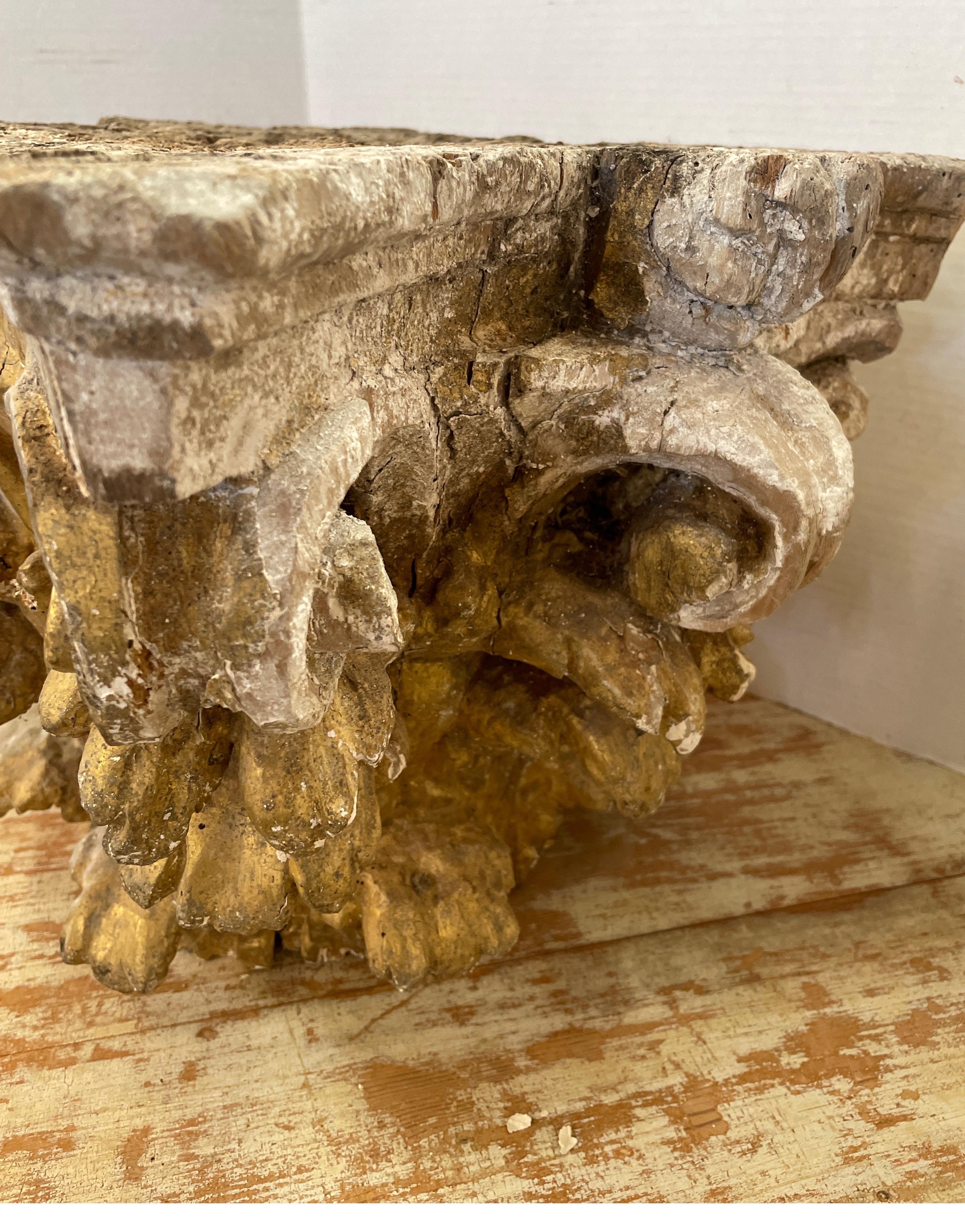 This is a nice size capital from Italy. Normally these were top a column inside cathedrals throughout the world. It’s beautifully hand carved by an artesian out of wood. The gold gilt finished is from the original patina. It makes for a great