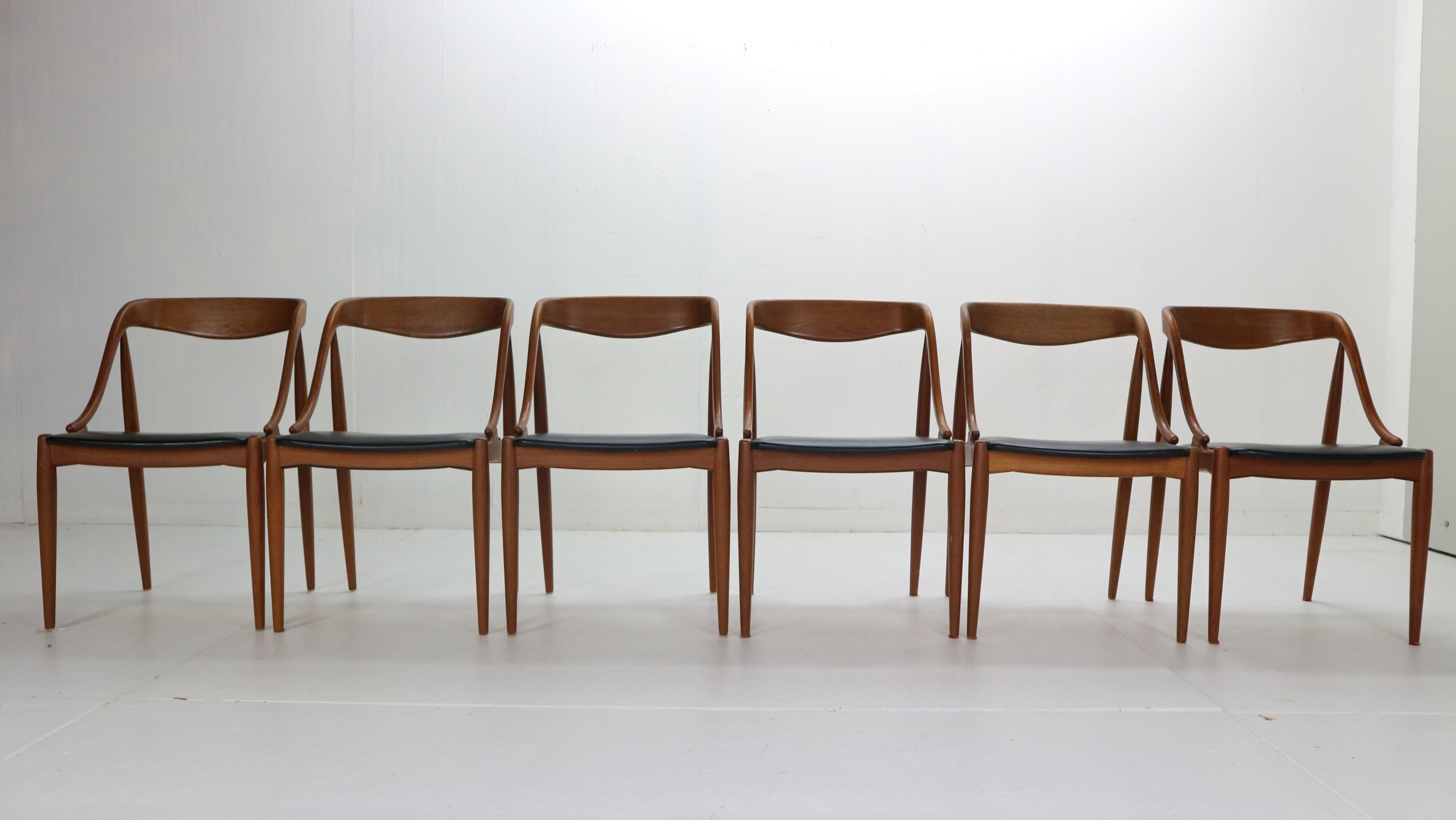 Beautiful set of six dinning room chairs designed by Johannes Andersen for Uldum Møbelfabrik, 1960s Denmark.

The chairs are made of solid teak wood frame. Organic form frame provides not only elegant Danish design but comfortable seating. 
Black