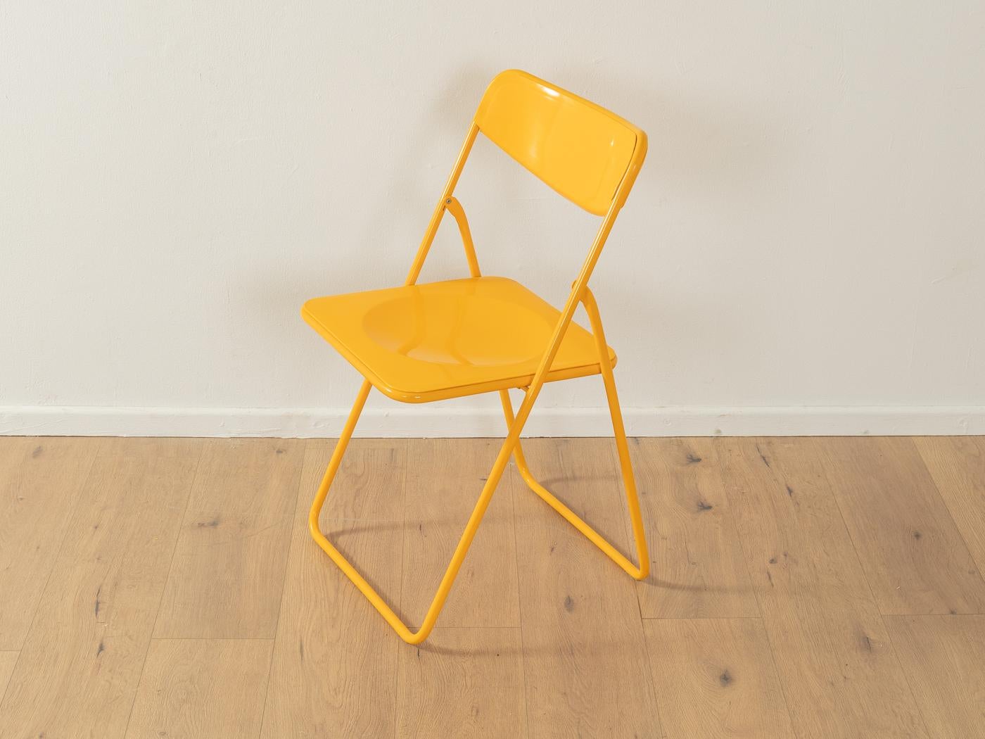 Timeless Ted folding chairs by Niels Gammelgaard for IKEA from the 1970s in yellow. High-quality metal frame with plastic backrest and seat. The offer includes six chairs.

Quality Features:
good workmanship
high-quality materials
Made in Sweden.