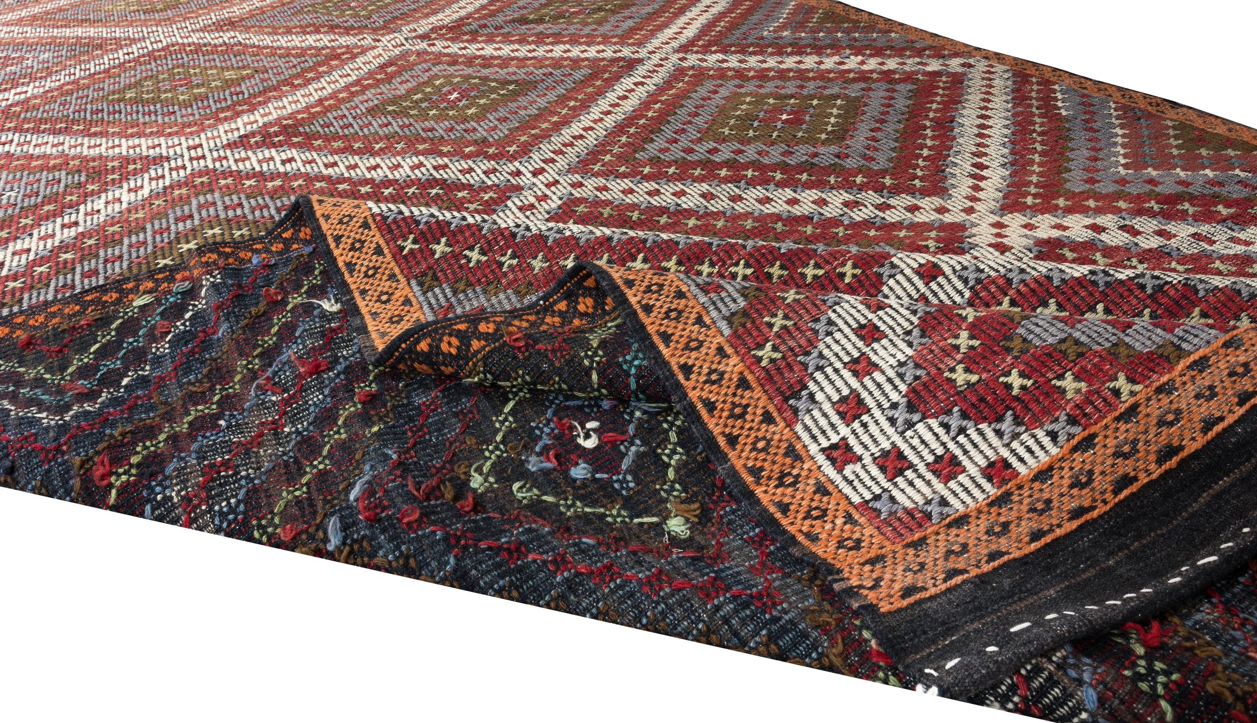 This attractive flat-weave rug is handwoven in fine local wool to create a sturdy floor covering. This type of Kilims (woven in the intricate 