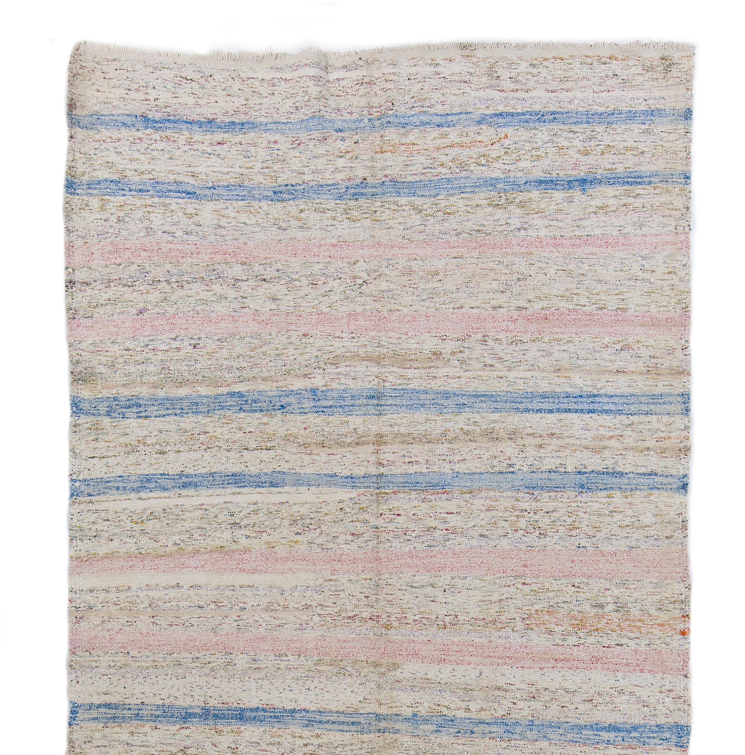 A vintage simple, minimalist and functional hand-woven flat-weave/kilim runner rug from Eastern Turkey, made of cotton, in the 1960s by then nomadic people of the area for their own daily use. It features a striped design in blue and pink against a