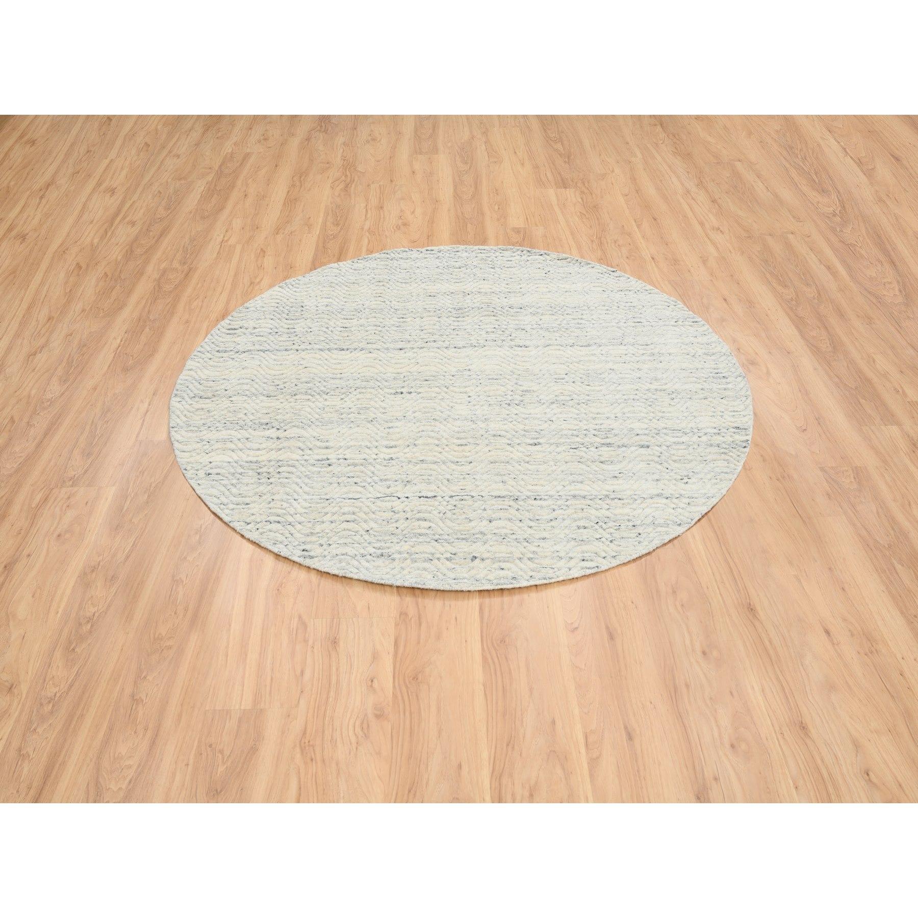 This is a truly genuine one-of-a-kind Beige, Soft Wool Hand Loomed, Variegated Textured Modern Design, Round Oriental Rug. It has been Loomed for months and months in the centuries-old weaving craftsmanship techniques by expert artisans.
Primary