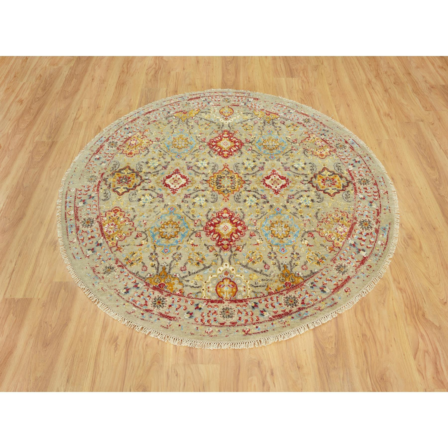 Sandcastle Beige, The Sunset Rosettes with Soft Colors, Wool and Silk, Hand Knotted, Round Oriental Rug
Primary materials: Wool & Silk
Latex: No Pile 
height: 0.25 Inches
Style: Transitional
Primary color: Beige
Secondary colors: Red, Yellow, Blue,