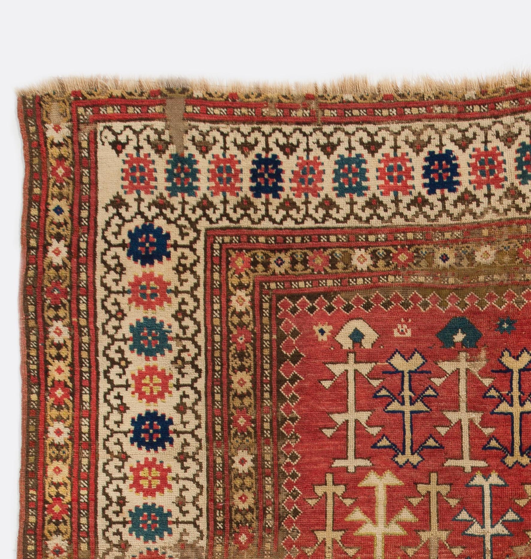 An antique Caucasian Kazak rug. Finely hand-knotted with even medium wool pile on wool foundation. Very good condition. Sturdy and as clean as a brand new rug (deep washed professionally).